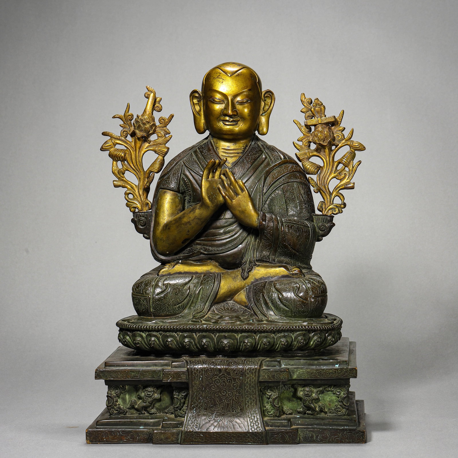 A GILT-BRONZE HIGH LAMA FIGURE: A GILT-BRONZE HIGH LAMA FIGURE Height: 13 in. (33 cm)