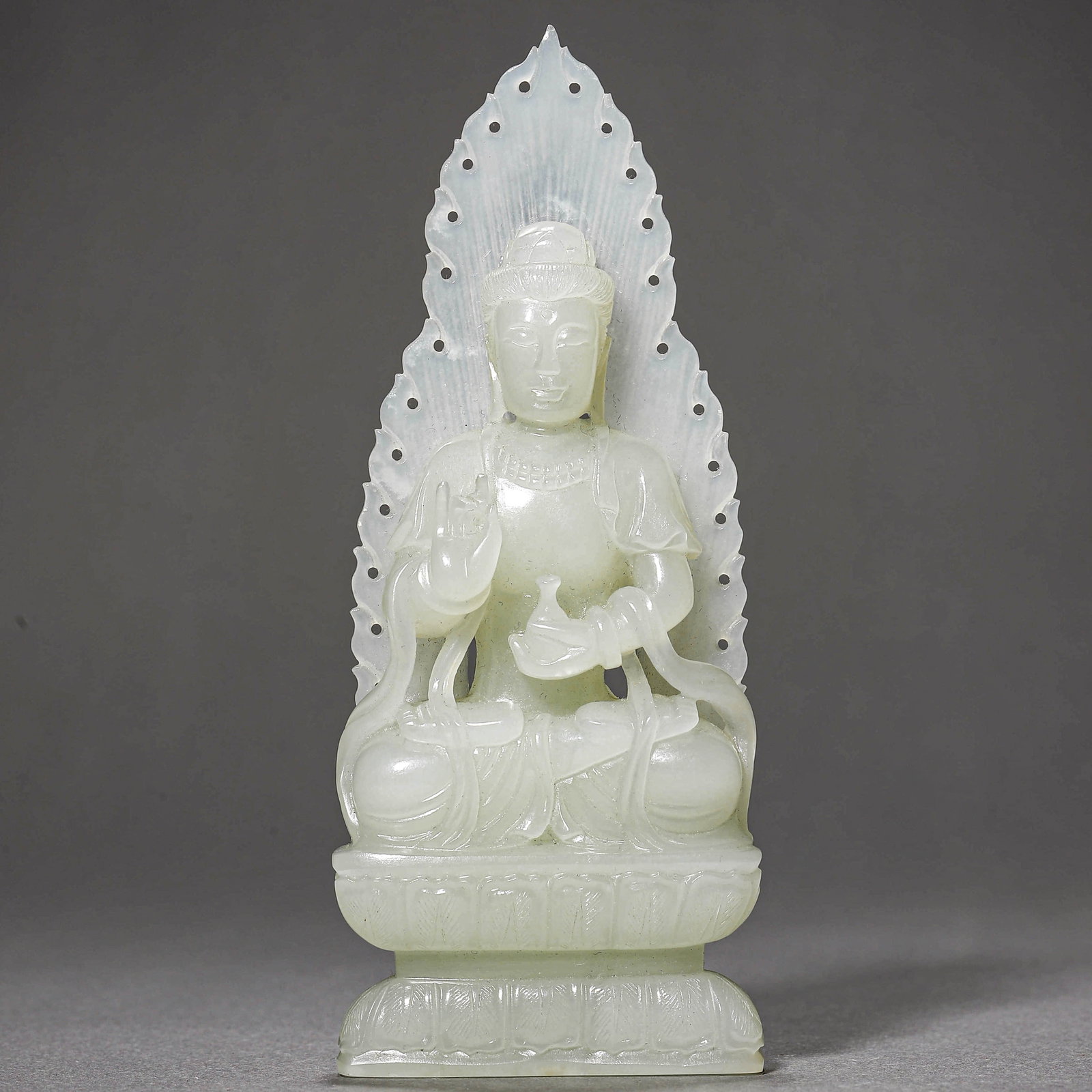 A WHITE JADE GUANYIN FIGURE: A WHITE JADE GUANYIN FIGURE Height: 5 1/2 in. (14 cm)