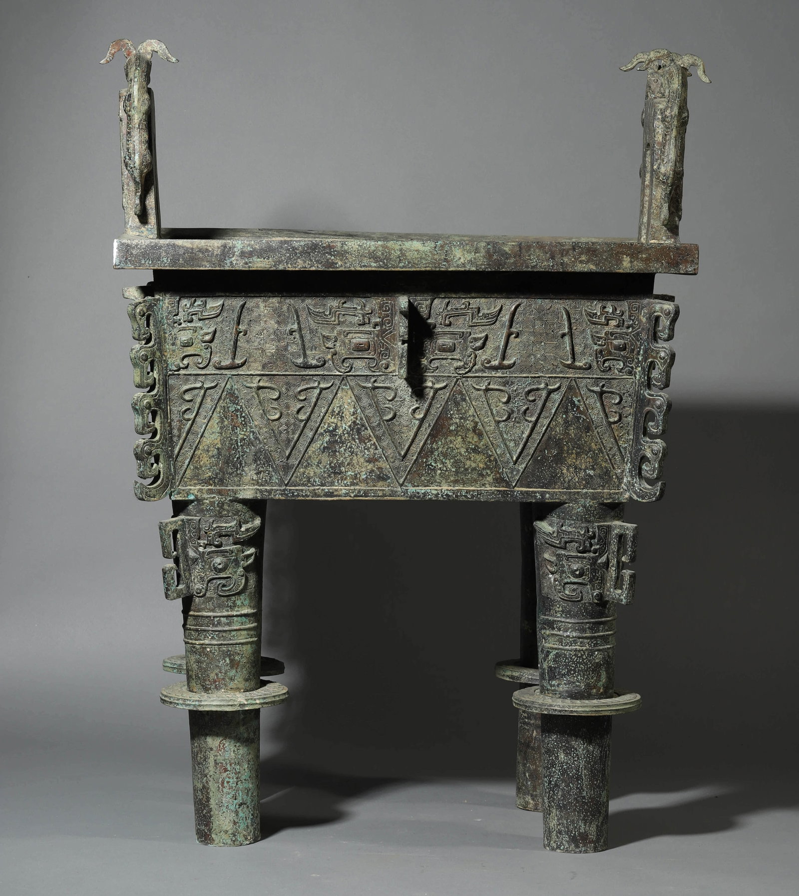A BRONZE TRIPOD DING CENSER: A BRONZE TRIPOD DING CENSER Length: 24 13/16 in. (63 cm), Width: 18 11/16 in. (47.5 cm), Height: 35 7/16 in. (90 cm)