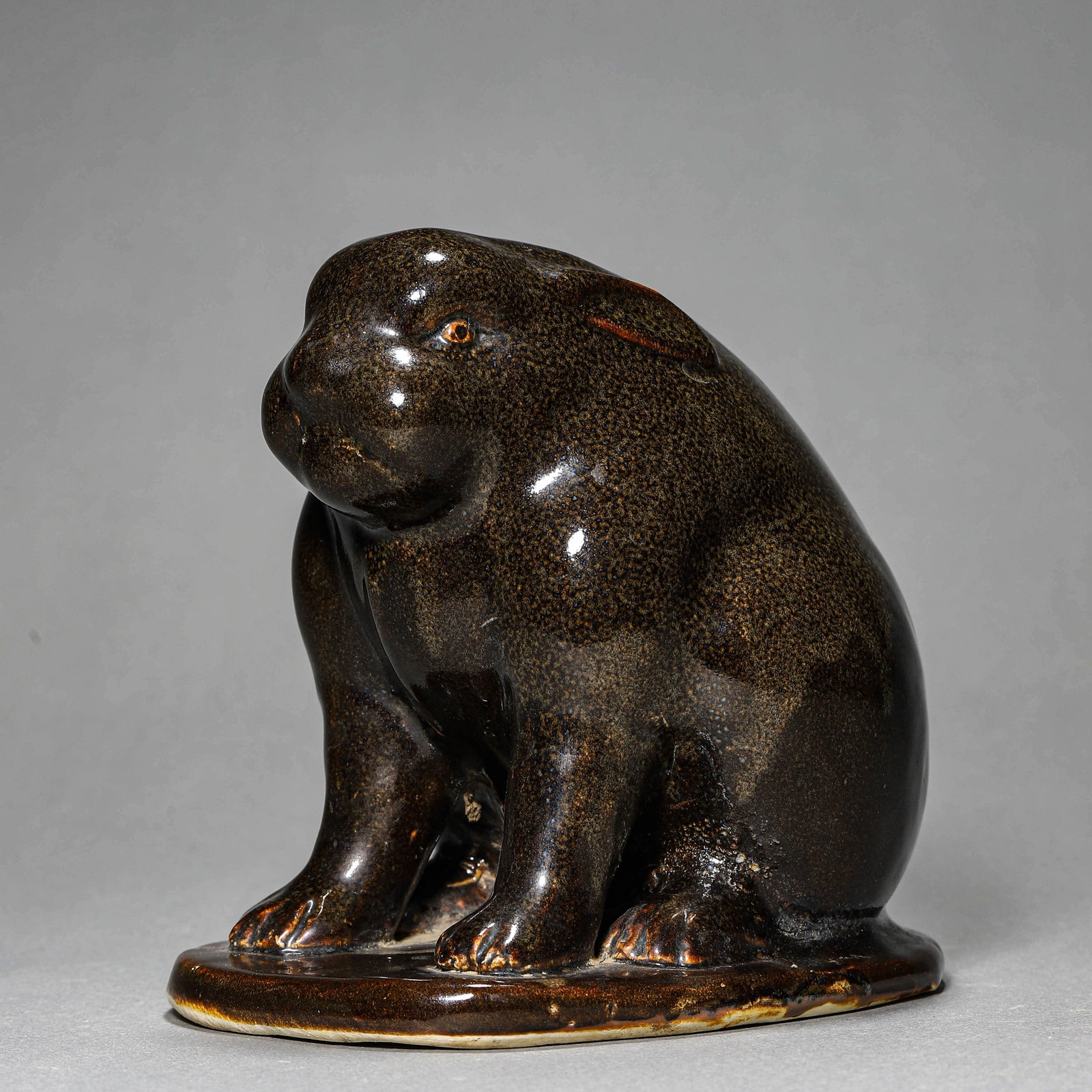 A TEA-DUST-GLAZED RABBIT FIGURE (1 of 5)