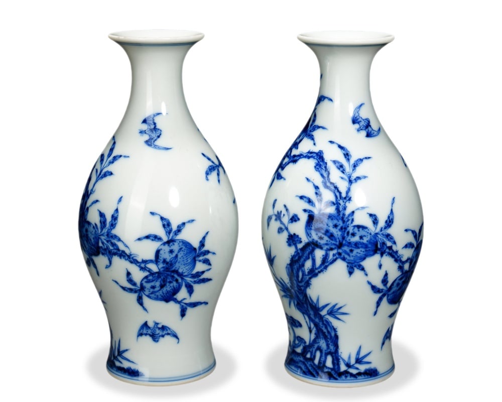 PAIR OF YONGZHENG BLUE AND WHITE 'BATS AND PEACHES' OLIVE-SHAPED VASES: 6 1/2 x 3 in (16.5 x 7.5 cm) Pair of Yongzheng Blue and White 'Bats and Peaches' Olive-Shaped Vases Dimensions: H: 6 1/2 in (16.5 cm); W: 3 in (7.5 cm) This refined pair of small olive-shaped vases