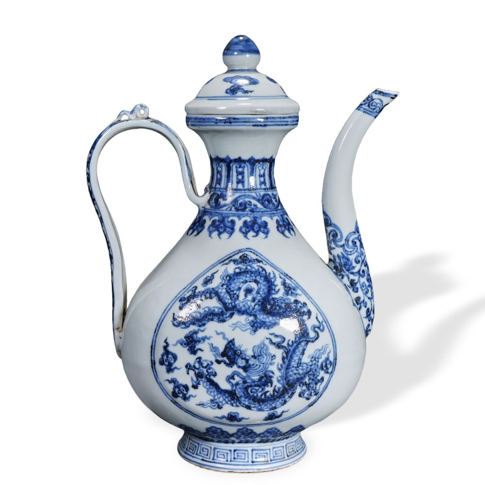 YUAN DYNASTY BLUE AND WHITE 'DRAGON MEDALLION' EWER: Yuan Dynasty Blue and White 'Dragon Medallion' Ewer Dimensions: H: 9 3/4 in (25 cm); W: 7 3/4 in (20 cm) This finely potted blue-and-white ewer presents the classic pear-shaped form favored for Yuan d
