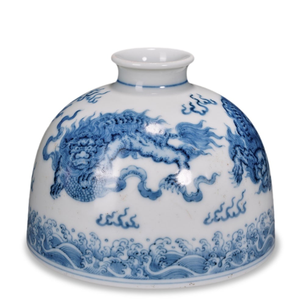 YONGZHENG BLUE AND WHITE 'SEA DRAGON' HORSESHOE-SHAPED ZUN: 4 x 4 1/2 in (10 x 11.5 cm) Yongzheng Blue and White 'Sea Dragon' Horseshoe-Shaped Zun Dimensions: H: 4 in (10 cm); W: 4 1/2 in (11.5 cm) This refined small zun vase exemplifies the supreme refinement
