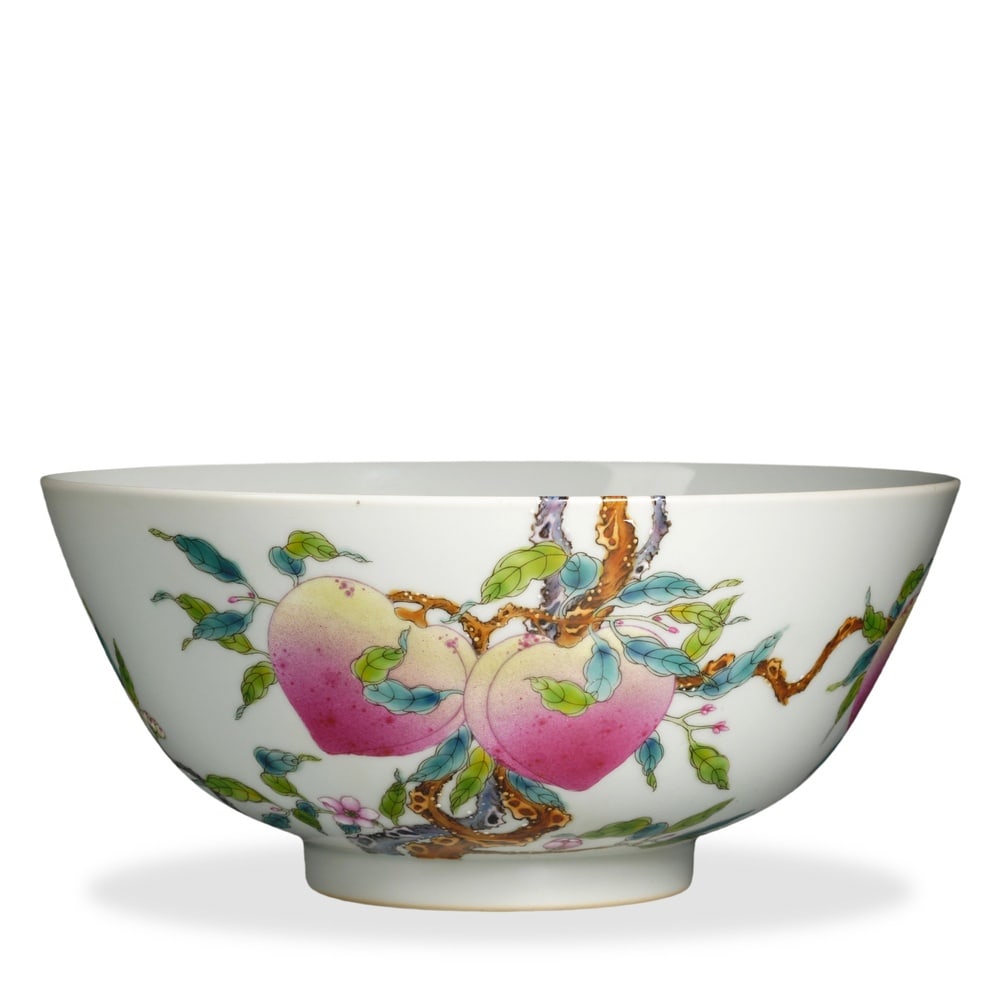 YONGZHENG FAMILLE ROSE 'OVER-THE-WALL EIGHT PEACHES' LARGE BOWL: 4 x 8 7/8 in (10 x 22.5 cm) Yongzheng Famille Rose 'Over-the-Wall Eight Peaches' Large Bowl Dimensions: D: 8 7/8 in (22.5 cm); H: 4 in (10 cm) This finely potted large bowl exemplifies the supreme