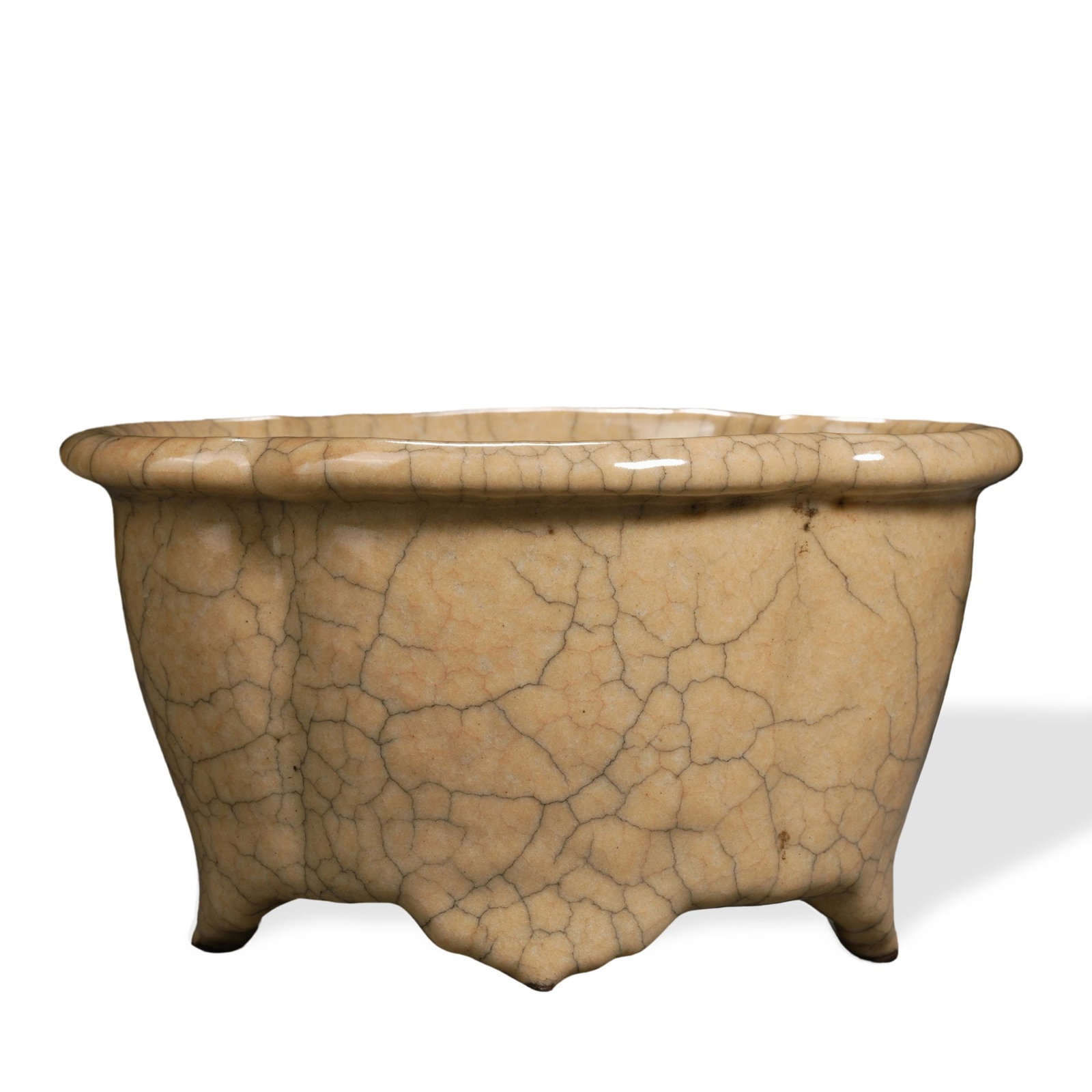 SONG DYNASTY GE WARE YELLOW GLAZED FLOWER POT: 3 3/8 x 6 1/8 in (8.5 x 15.5 cm) Song Dynasty Ge Ware Yellow Glazed Flower Pot Dimensions: H: 3 3/8 in (8.5 cm); W: 6 1/8 in (15.5 cm) This refined flower pot embodies the contemplative aesthetic of
