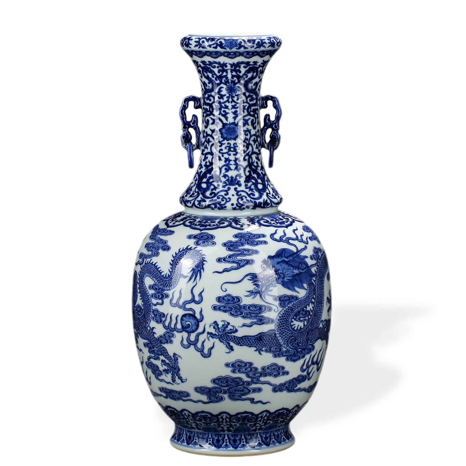 QIANLONG BLUE AND WHITE 'TWIN DRAGONS CHASING THE PEARL' VASE WITH MOVABLE-RING HANDLES: 22 1/2 x 10 5/8 in (57 x 27 cm) Qianlong Blue and White 'Twin Dragons Chasing the Pearl' Vase with Movable-Ring Handles Dimensions: H: 22 1/2 in (57 cm); W: 10 5/8 in (27 cm) This imposing vase