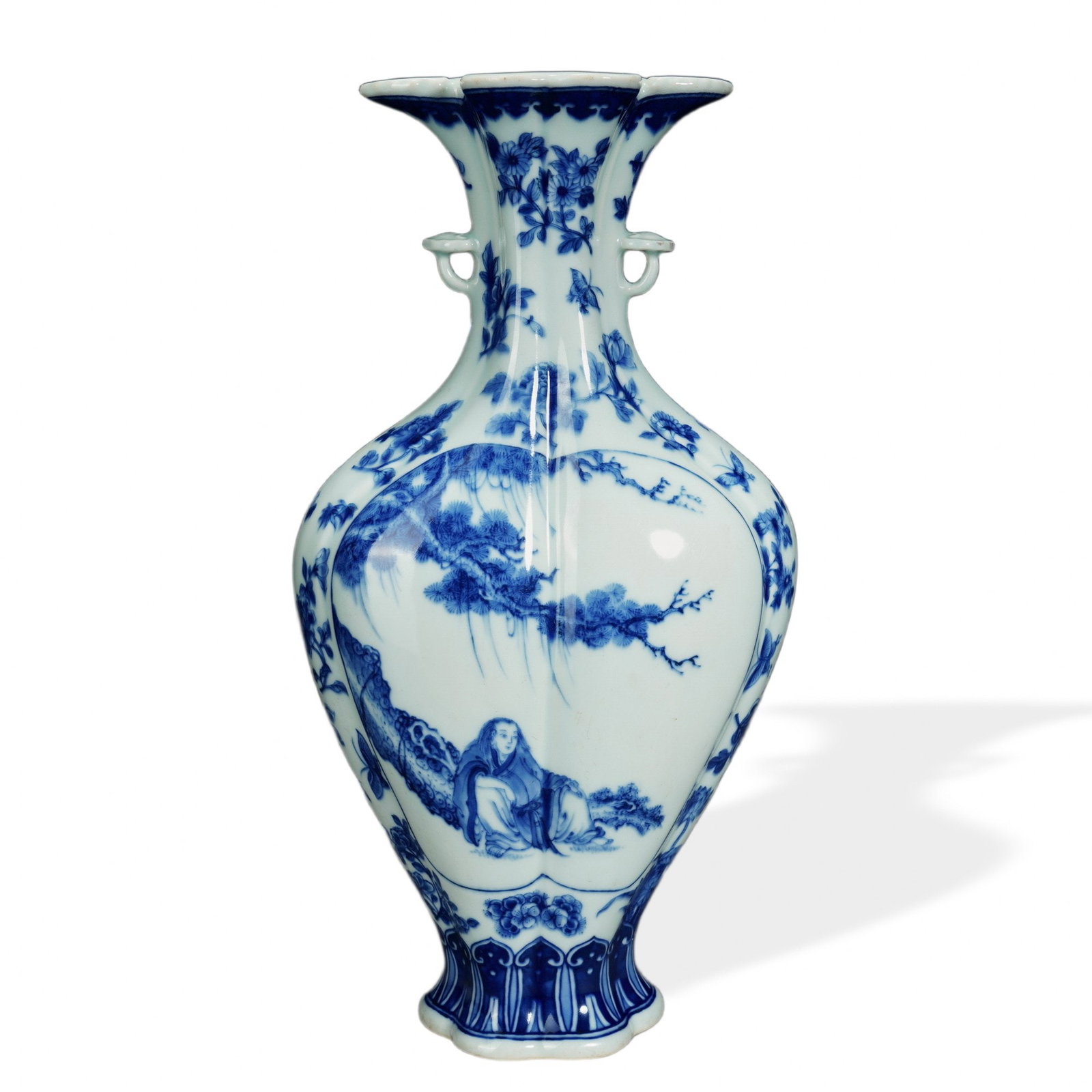YONGZHENG BLUE AND WHITE PICTORIAL VASE WITH PETAL-FORM MOUTH AND RUYI HANDLES: Yongzheng Blue and White Pictorial Vase with Petal-Form Mouth and Ruyi Handles Dimensions: H: 11 in (28 cm); W: 5 1/2 in (14 cm) This refined vase exemplifies the elegant proportions of