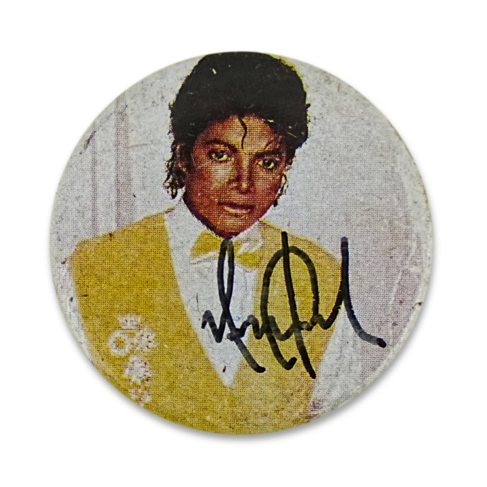 MICHAEL JACKSON SIGNED THRILLER BUTTON: Diameter 1 1/8 in (3 cm) Few entertainers in modern history possess the cultural impact and worldwide recognition of Michael Jackson. Revered as the "King of Pop," Jackson transformed popular music