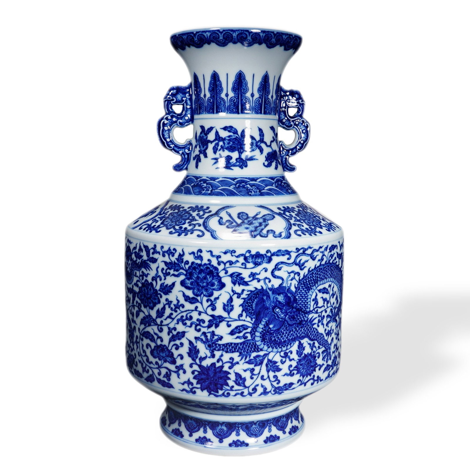 QIANLONG BLUE AND WHITE 'DRAGON AMONG FLOWERS' VASE WITH MYTHICAL-DRAGON HANDLES: 16 7/8 x 9 in (43 x 23 cm) Qianlong Blue and White 'Dragon Among Flowers' Vase with Mythical-Dragon Handles Dimensions: H: 16 7/8 in (43 cm); W: 9 in (23 cm) This commanding vase exemplifies the preci