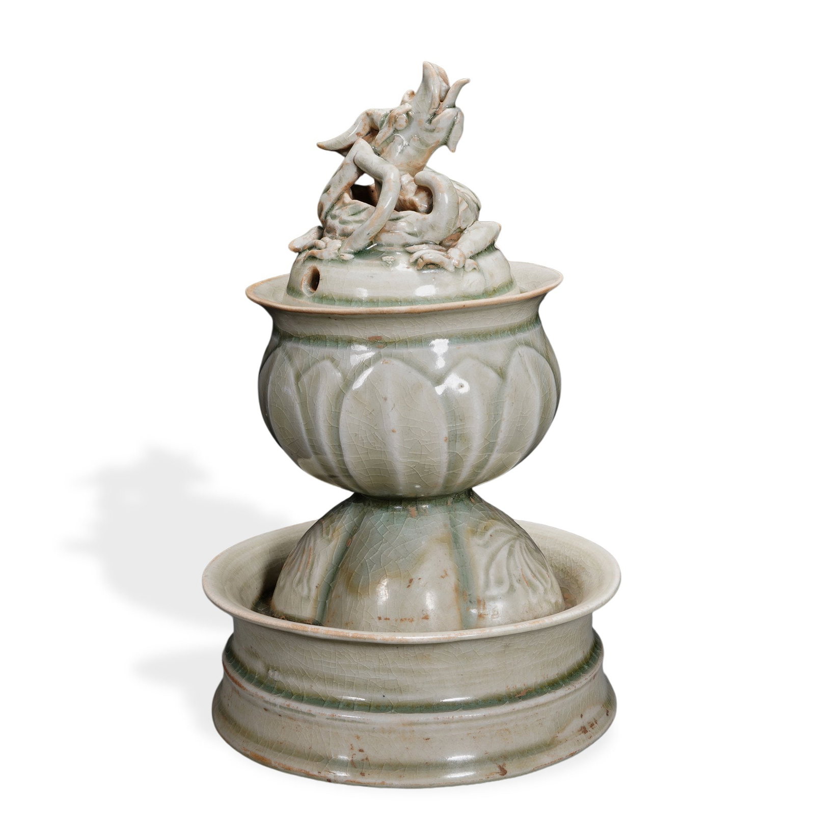 FIVE DYNASTIES YUE WARE CELADON COILED DRAGON INCENSE BURNER: 9 x 5 7/8 in (23 x 15 cm) Five Dynasties Yue Ware Celadon Coiled Dragon Incense Burner Dimensions: H: 9 in (23 cm); W: 5 7/8 in (15 cm) This refined incense burner exemplifies the supreme aesthetic