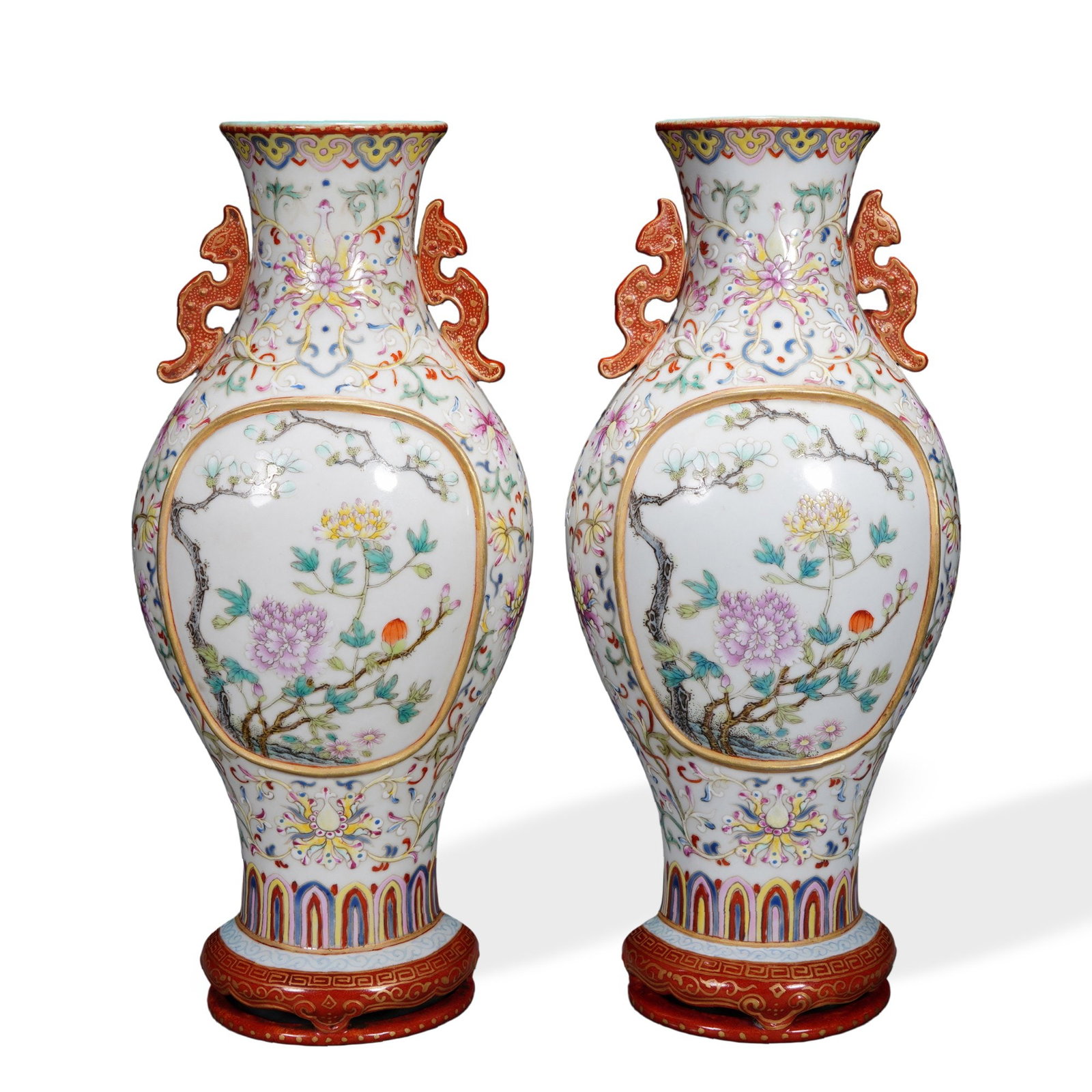 PAIR OF QIANLONG FAMILLE ROSE WALL VASES WITH CARTOUCHES OF LOTUS SCROLL ON YELLOW GROUND: 8 1/4 x 3 3/4 in (21 x 9.5 cm) Pair of Qianlong Famille Rose Wall Vases with Cartouches of Lotus Scroll on Yellow Ground Dimensions: H: 8 1/4 in (21 cm); W: 3 3/4 in (9.5 cm) This refined pair of wall