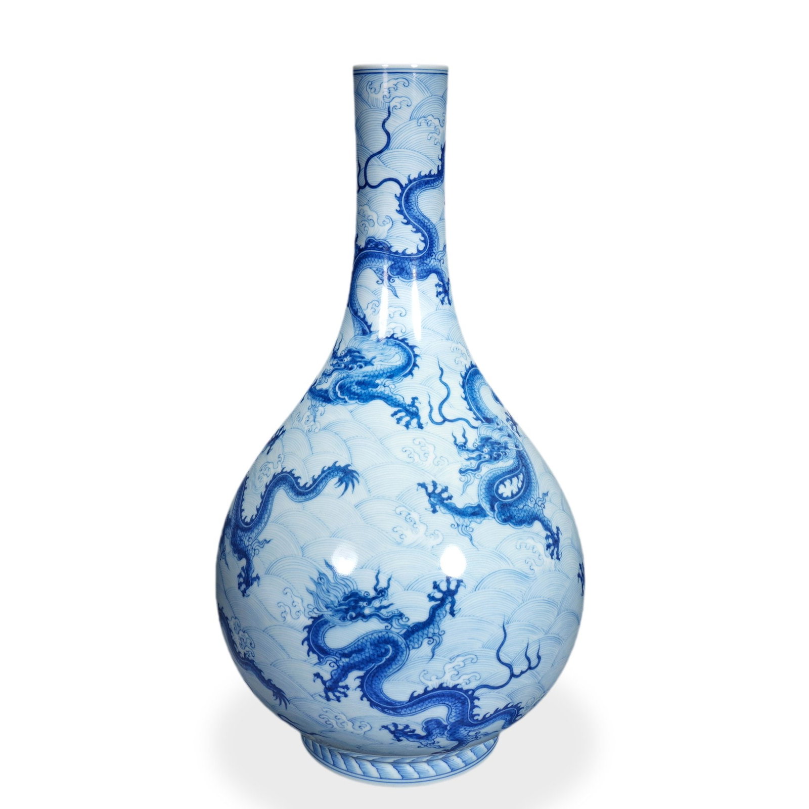 YONGZHENG BLUE AND WHITE 'SEA DRAGON' PEAR-SHAPED VASE: 15 3/8 x 7 7/8 in (39 x 20 cm) Yongzheng Blue and White 'Sea Dragon' Pear-Shaped Vase Dimensions: H: 15 3/8 in (39 cm); W: 7 7/8 in (20 cm) This commanding pear-shaped vase (danping, literally