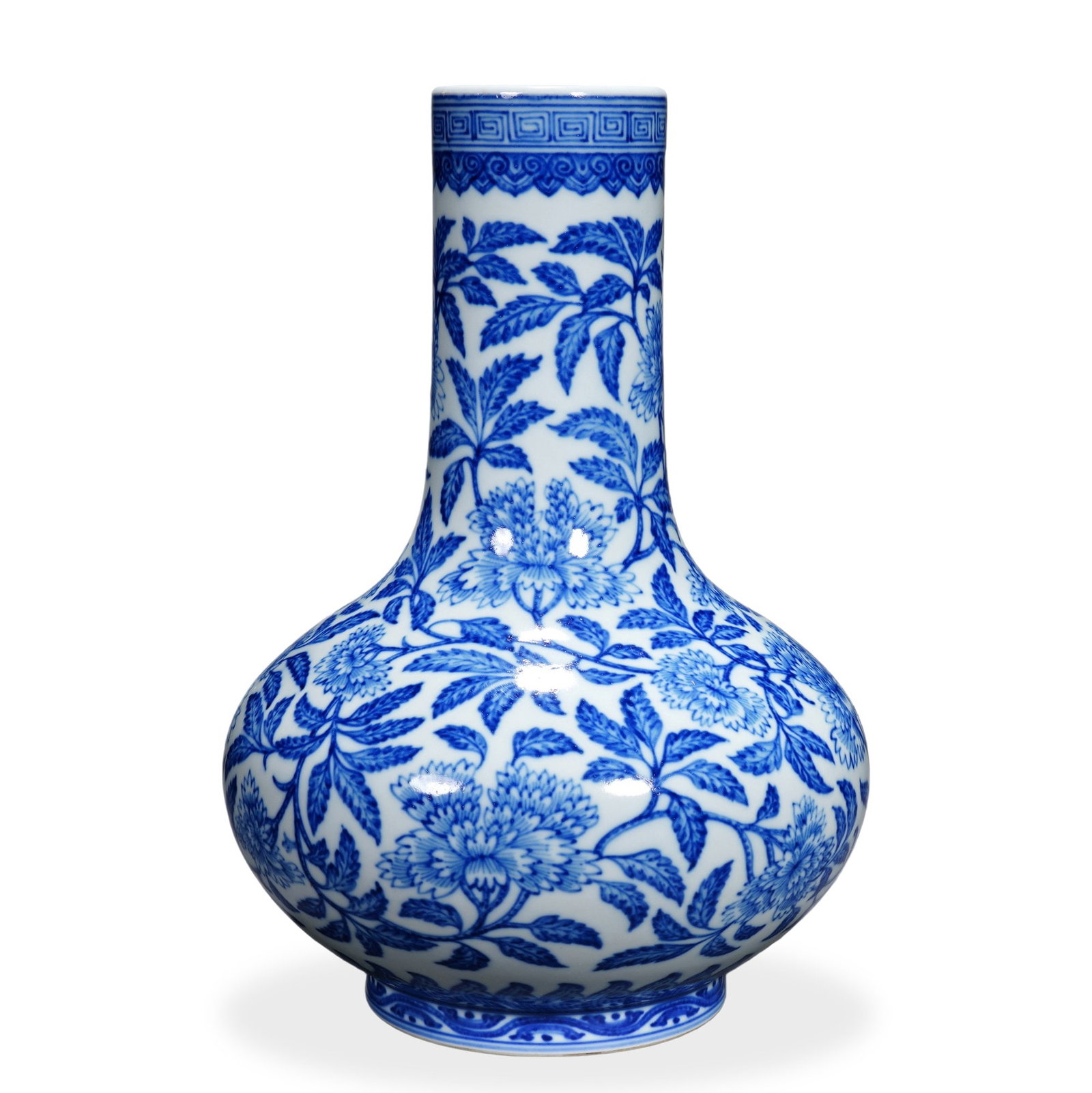 QIANLONG BLUE AND WHITE 'PEONY' FLATTENED-BODY VASE: 9 7/8 x 6 1/4 in (25 x 16 cm) Qianlong Blue and White 'Peony' Flattened-Body Vase Dimensions: H: 9 7/8 in (25 cm); W: 6 1/4 in (16 cm) This finely potted vase exemplifies the precision of