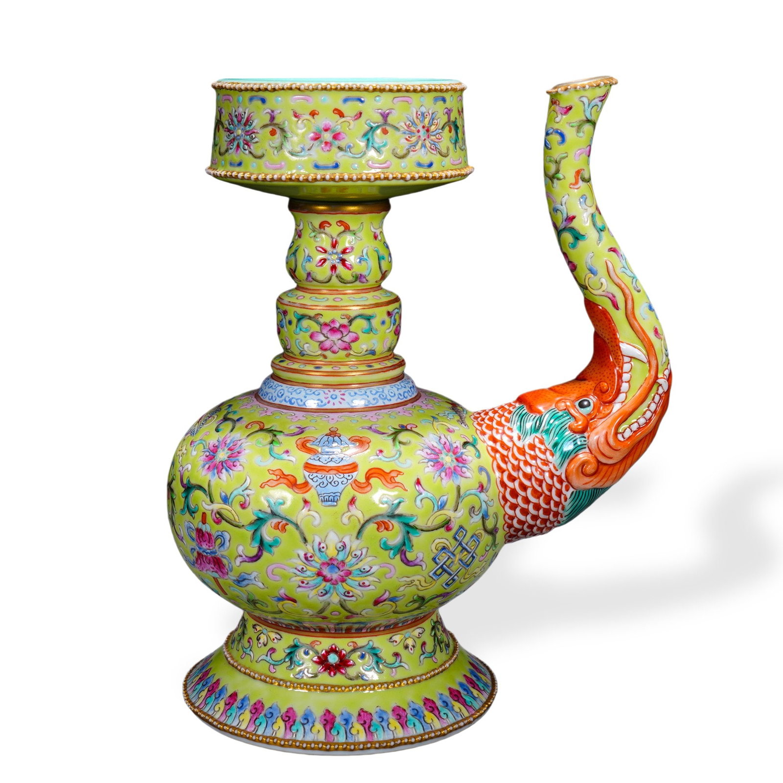 QIANLONG FAMILLE ROSE 'EIGHT AUSPICIOUS EMBLEMS' BEN BA HU HOLY-WATER EWER ON GREEN GROUND: 7 1/4 x 5 1/2 in (18.5 x 14 cm) Qianlong Famille Rose 'Eight Auspicious Emblems' Ben Ba Hu Holy-Water Ewer on Green Ground Dimensions: H: 7 1/4 in (18.5 cm); W: 5 1/2 in (14 cm) This refined ewer