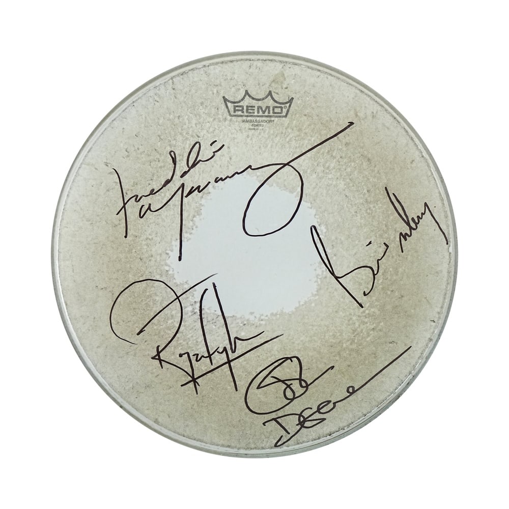 QUEEN FULLY SIGNED REMO AMBASSADOR COATED DRUMHEAD: Diameter 13 3/4 in (35 cm) This Remo Ambassador Coated drumhead has been fully signed by all four members of Queen: Freddie Mercury, Brian May, Roger Taylor, and John Deacon. The signatures are