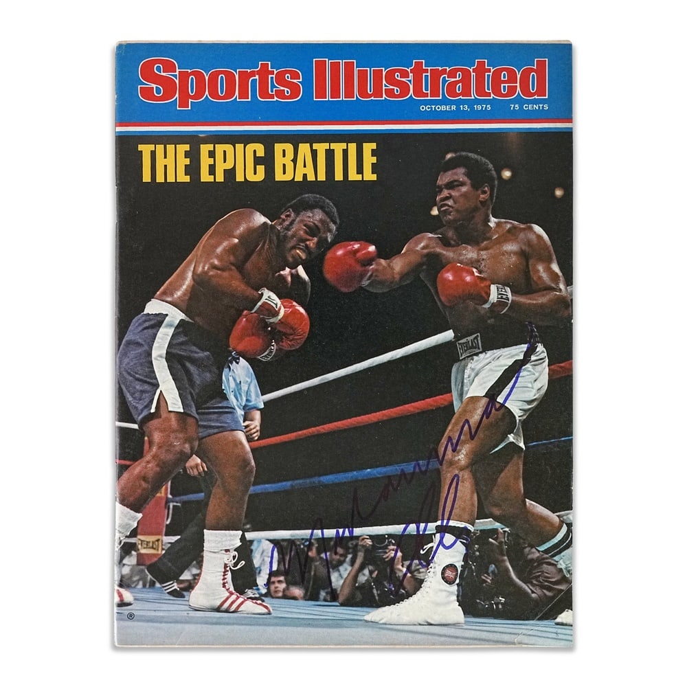 MUHAMMAD ALI SIGNED 1975 "SPORTS ILLUSTRATED" THRILLA IN MANILA MAGAZINE: 11 x 8 in (27.8 x 20.2 cm) Provenance and Authentication: According to the accompanying documentation provided by the consignor, the signatures have been examined with reference to multiple factors,