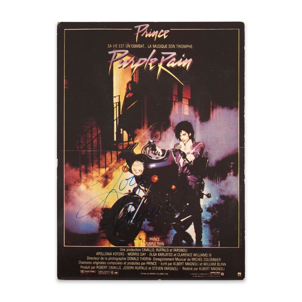 PRINCE SIGNED "PURPLE RAIN" POSTCARD (1984): 5 3/4 x 4 1/8 in (14.7 x 10.5 cm) This rare signed postcard features the French promotional cover of the 1984 cult film purple rain, boldly autographed by the legendary musician prince. The image