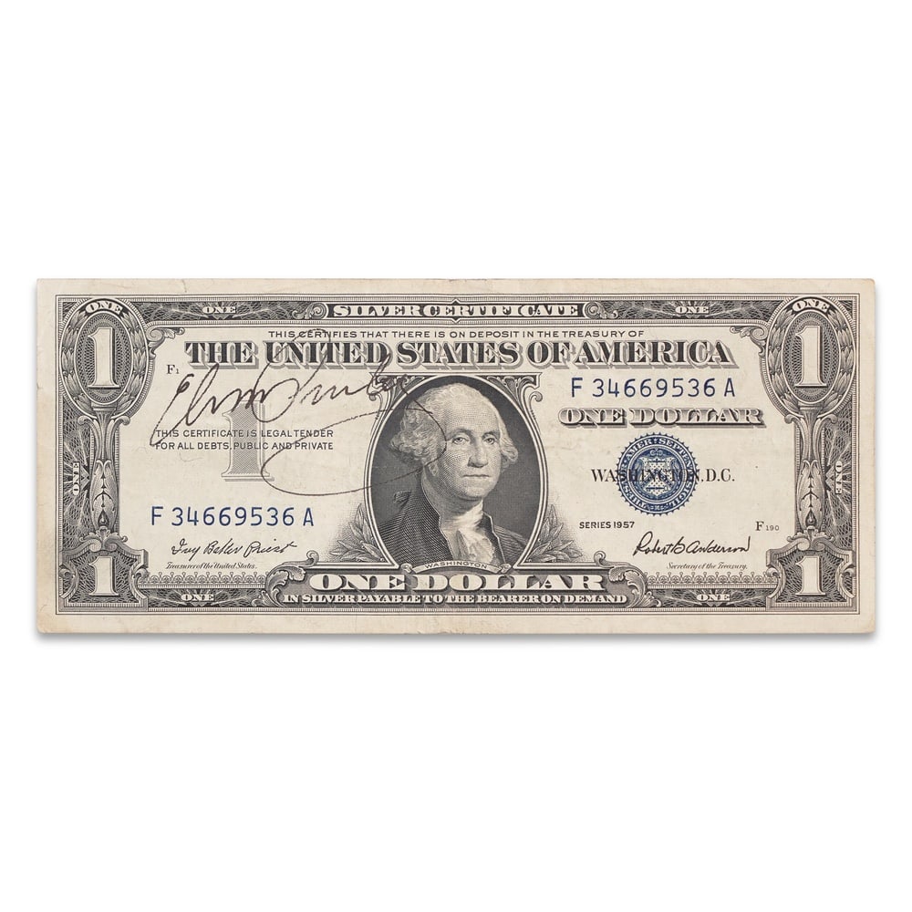 ELVIS PRESLEY SIGNED 1957 U.S. ONE DOLLAR SILVER CERTIFICATE: 6 1/8 x 2 1/2 in (15.5 x 6.5 cm) Provenance and Authentication: According to the Letter of Authenticity (LOA) and Certificate of Authenticity (COA) provided by the consignor, this collectible was
