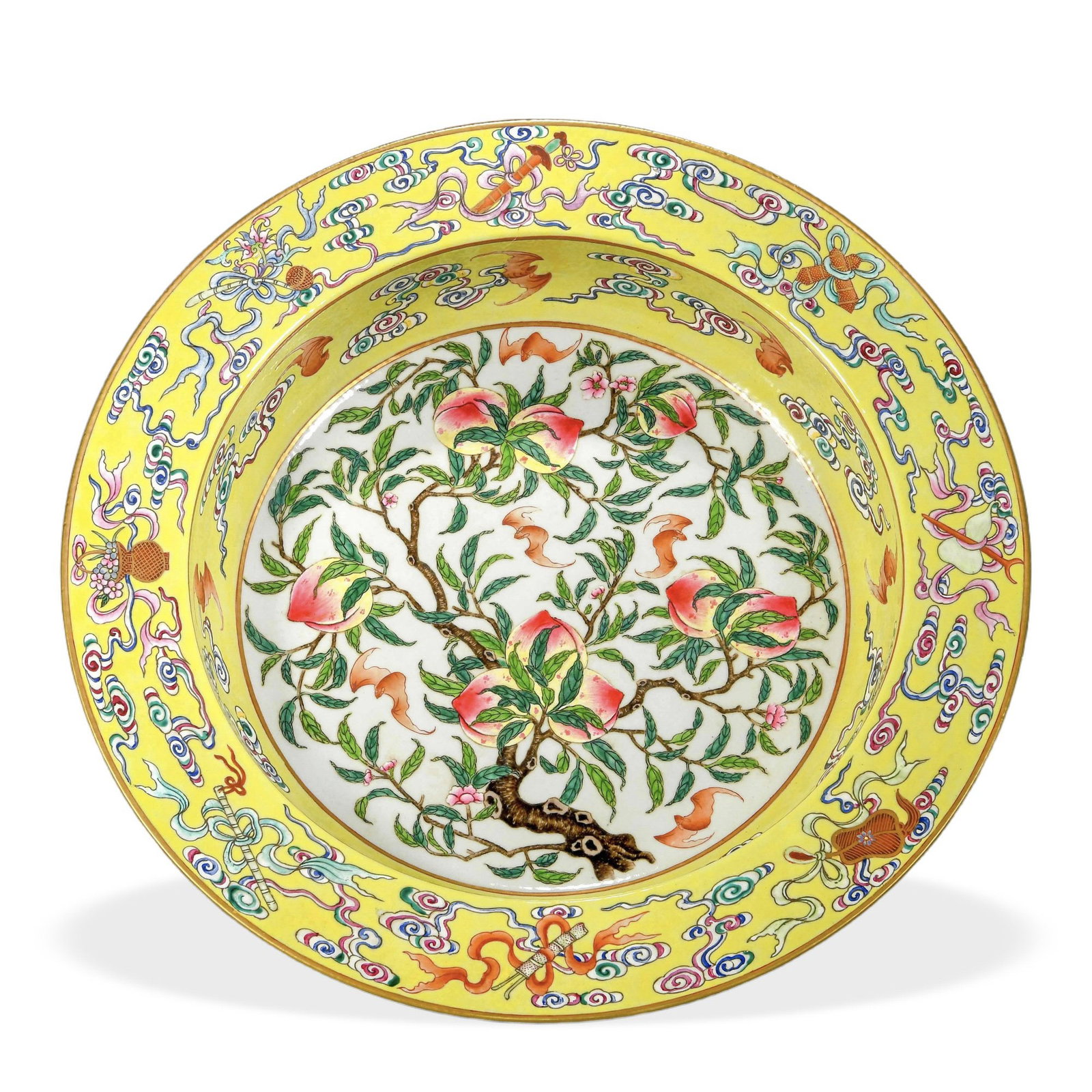 QIANLONG FAMILLE ROSE 'NINE PEACHES AND EIGHT DAOIST EMBLEMS' BASIN ON YELLOW GROUND