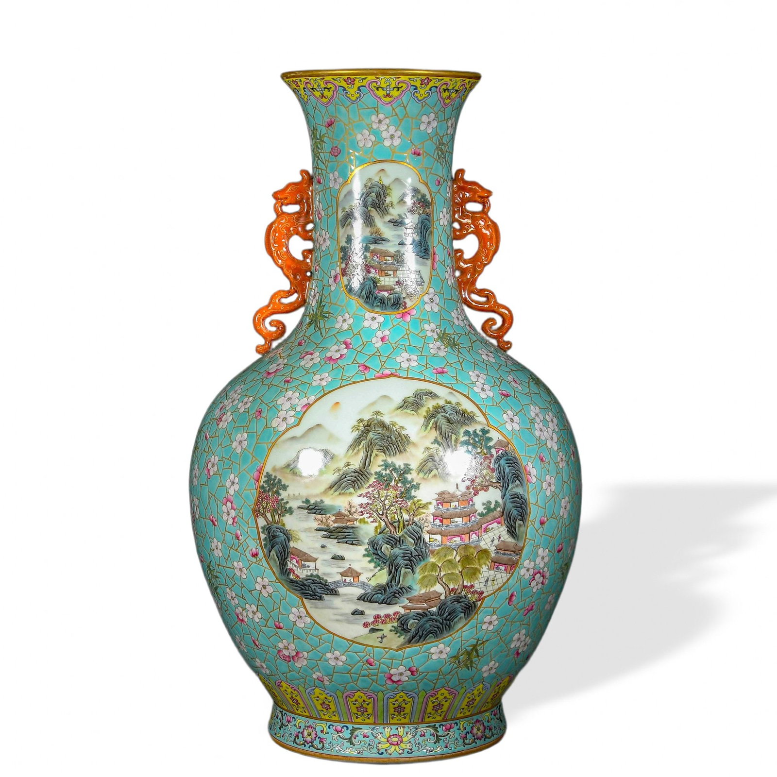 QIANLONG FAMILLE ROSE TWIN-HANDLED VASE WITH 'LANDSCAPE AND FIGURAL SCENE' CARTOUCHES ON TURQUOISE: Qianlong Famille Rose Twin-Handled Vase with 'Landscape and Figural Scene' Cartouches on Turquoise Cracked-Ice Ground Dimensions: H: 23 1/4 in (59 cm); W: 14 1/2 in (37 cm) This monumental twin-handle