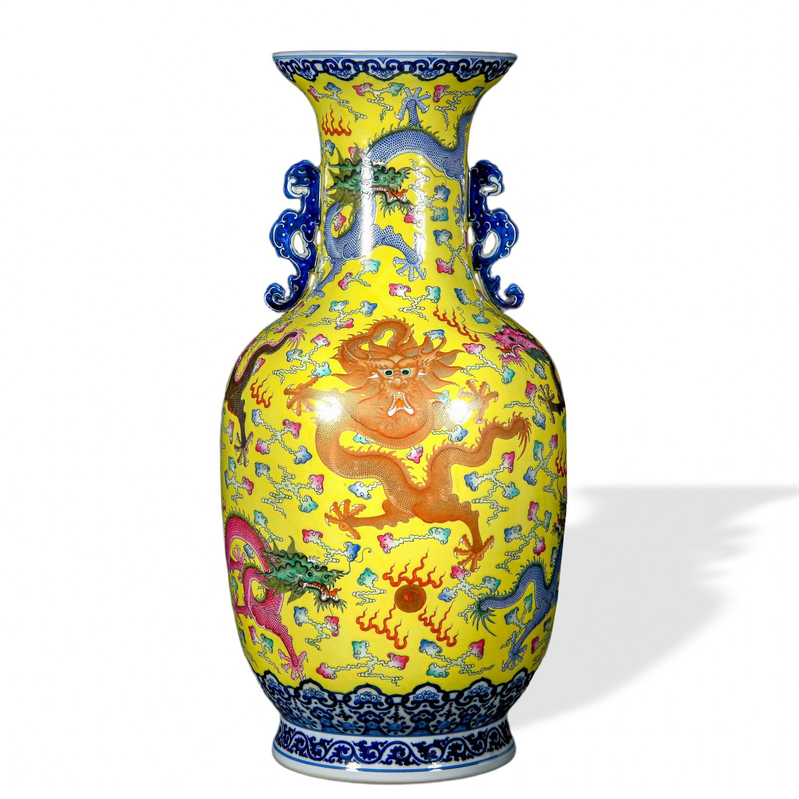 QIANLONG FAMILLE ROSE 'NINE DRAGONS' TWIN-HANDLED VASE ON YELLOW GROUND: Qianlong Famille Rose 'Nine Dragons' Twin-Handled Vase on Yellow Ground Dimensions: H: 23 1/4 in (59 cm); W: 11 3/4 in (30 cm) This monumental twin-handled vase exemplifies the most ambitious format o
