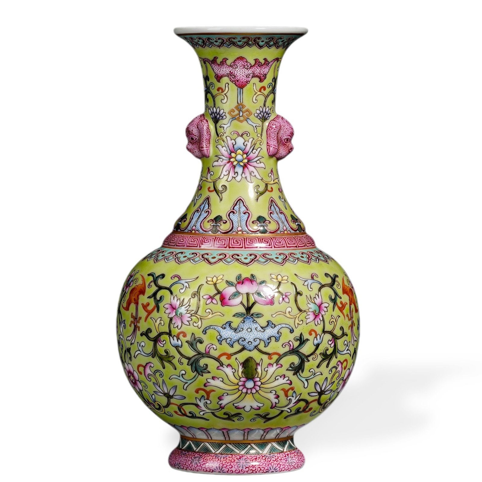 QIANLONG FAMILLE ROSE 'WESTERN LOTUS' VASE ON GREEN GROUND: 7 1/2 x 4 in (19 x 10 cm) Qianlong Famille Rose 'Western Lotus' Vase on Green Ground Dimensions: W: 4 in (10 cm); H: 7 1/2 in (19 cm) This refined small vase exemplifies the precision of Qianlong-peri