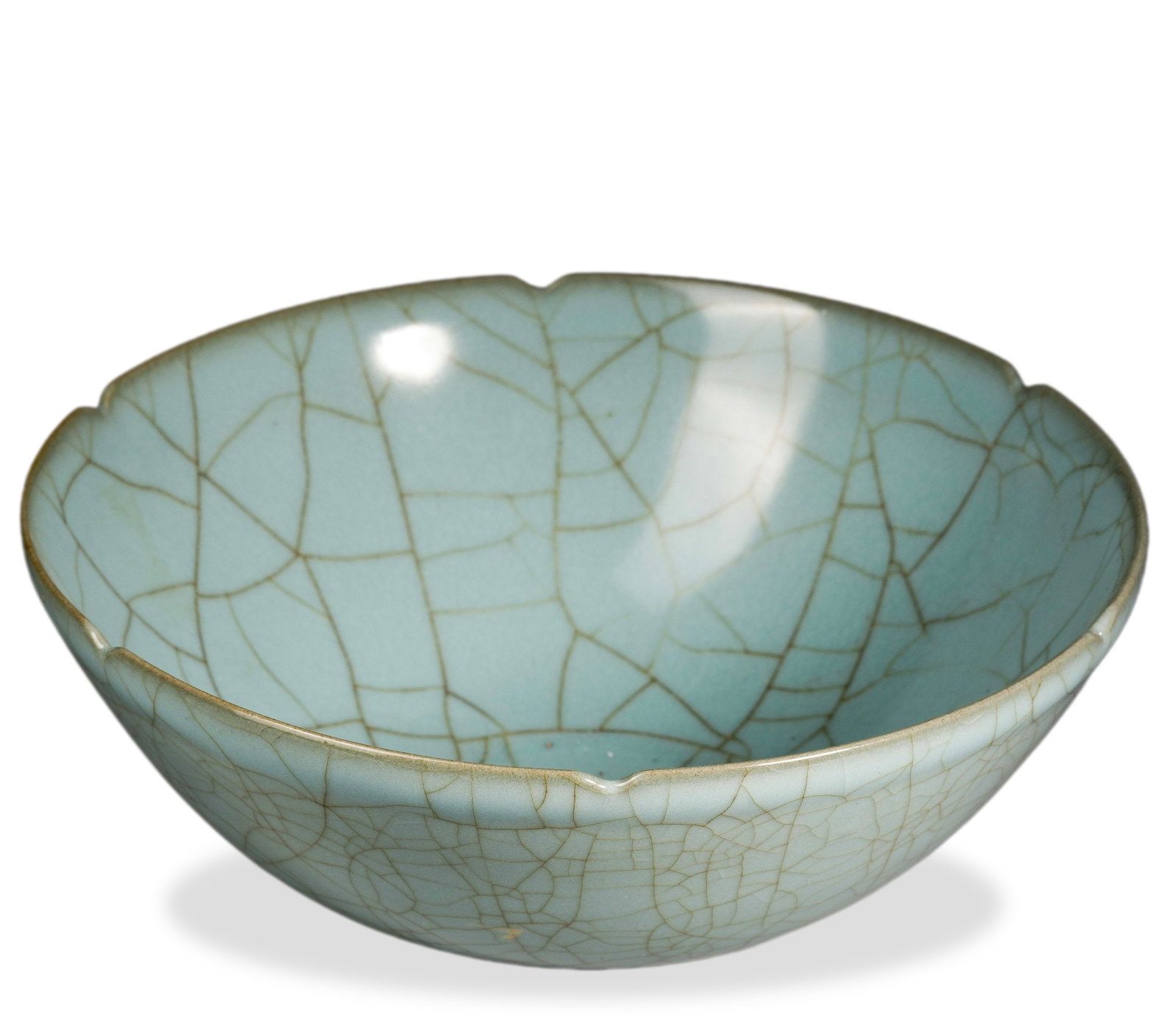 QIANLONG IMPERIAL-INSCRIBED CELADON CRACKLE-GLAZED FLOWER-MOUTH LARGE BOWL: 3 3/4 x 9 1/2 in (9.5 x 24 cm) Qianlong Imperial-Inscribed Celadon Crackle-Glazed Flower-Mouth Large Bowl Dimensions: D: 9 1/2 in (24 cm); H: 3 3/4 in (9.5 cm) This finely potted large bowl exemplifie