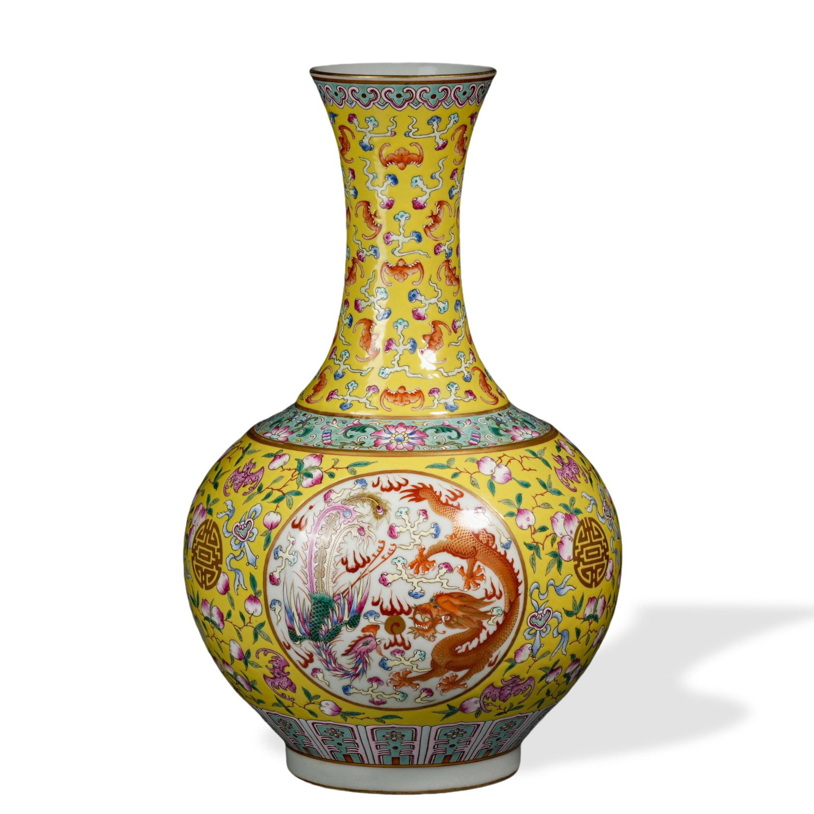 GUANGXU FAMILLE ROSE 'PHOENIX AND DRAGON' TRIBUTE VASE WITH CARTOUCHES ON YELLOW GROUND: 15 3/8 x 9 in (39 x 23 cm) Guangxu Famille Rose 'Phoenix and Dragon' Tribute Vase with Cartouches on Yellow Ground Dimensions: H: 15 3/8 in (39 cm); W: 9 in (23 cm) This commanding tribute vase