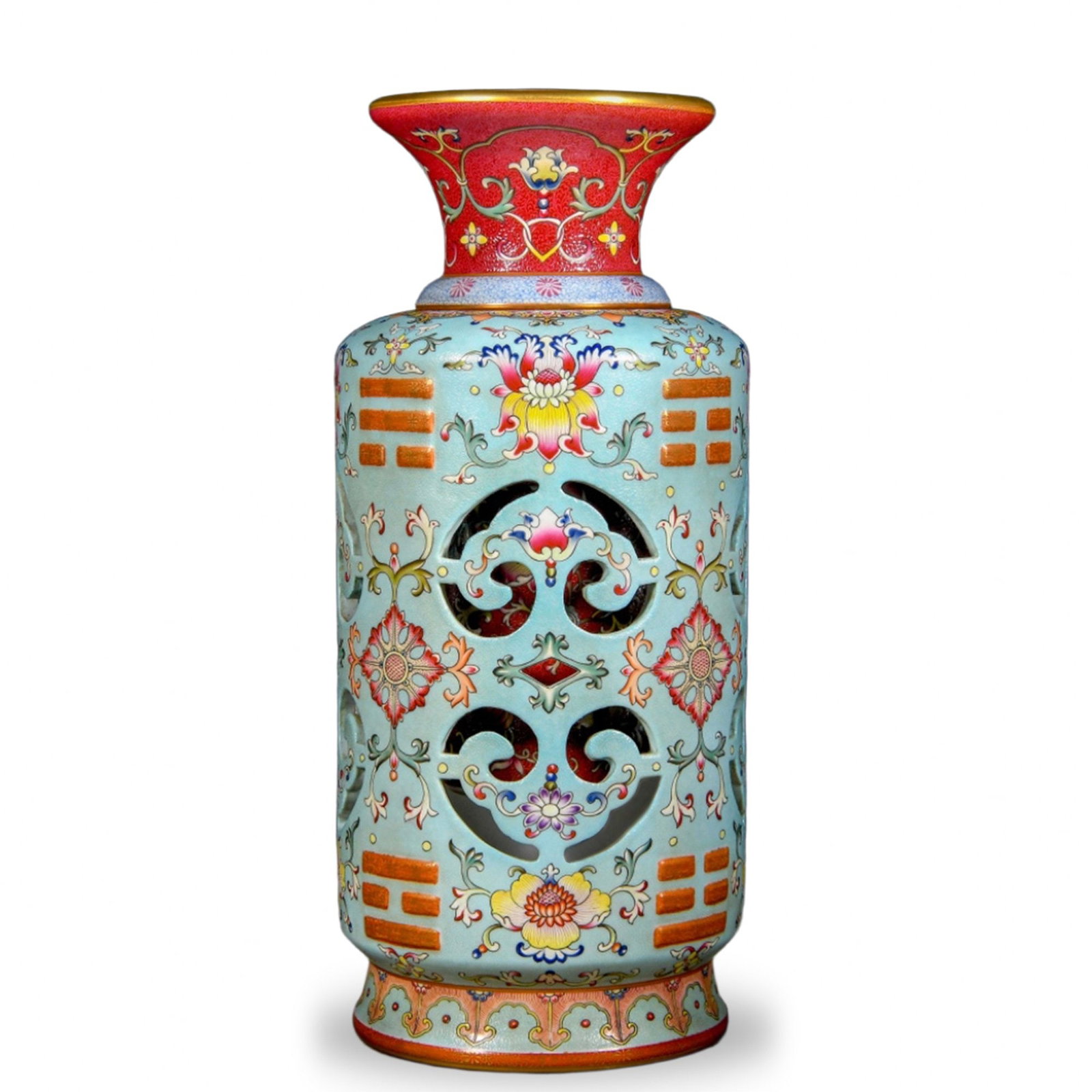 QIANLONG FAMILLE ROSE RETICULATED REVOLVING VASE WITH BAGUA TRIGRAMS ON CELADON GROUND: Qianlong Famille Rose Reticulated Revolving Vase with Bagua Trigrams on Celadon Ground Dimensions: H: 15 3/4 in (40 cm); W: 7 in (18 cm) This rare reticulated vessel belongs to the most technically de