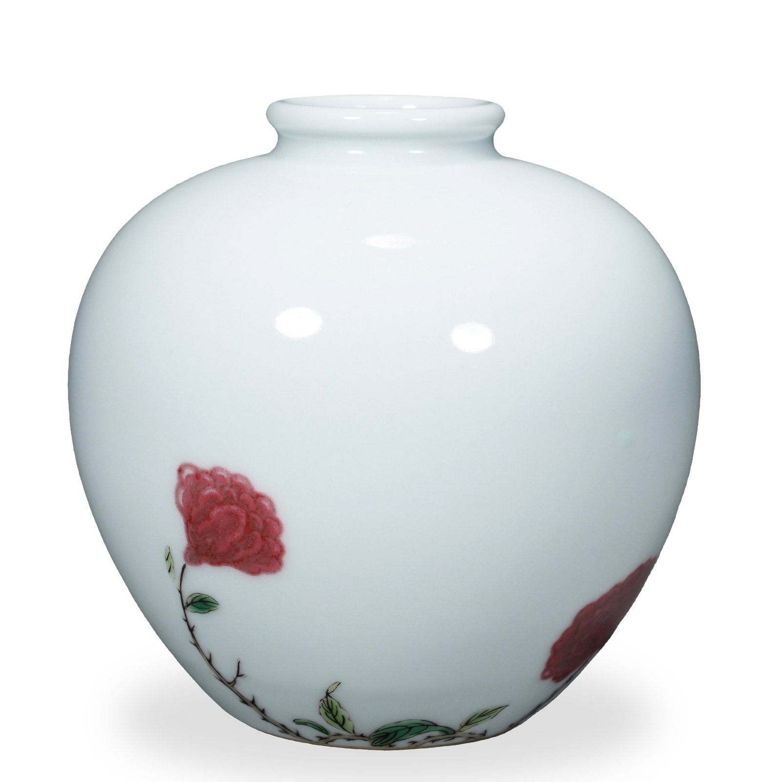 KANGXI UNDERGLAZE COPPER-RED AND FAMILLE VERTE 'FLOWERING ROSE' APPLE JAR: Kangxi Underglaze Copper-Red and Famille Verte 'Flowering Rose' Apple Jar Dimensions: H: 3 1/2 in (8.5 cm); W: 3 1/2 in (9 cm) This finely potted small jar embodies the apple-form (pingguo zun)