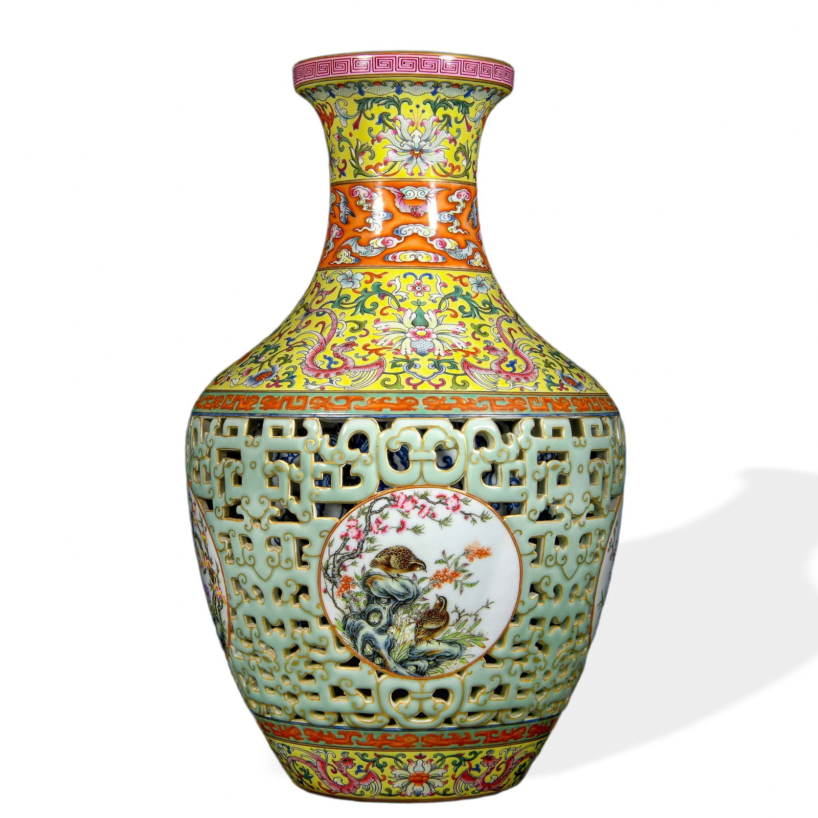 QIANLONG RETICULATED 'MAGPIE ON PLUM' SLEEVE VASE WITH FAMILLE ROSE DECORATION ON CELADON GROUND (1 of 3)