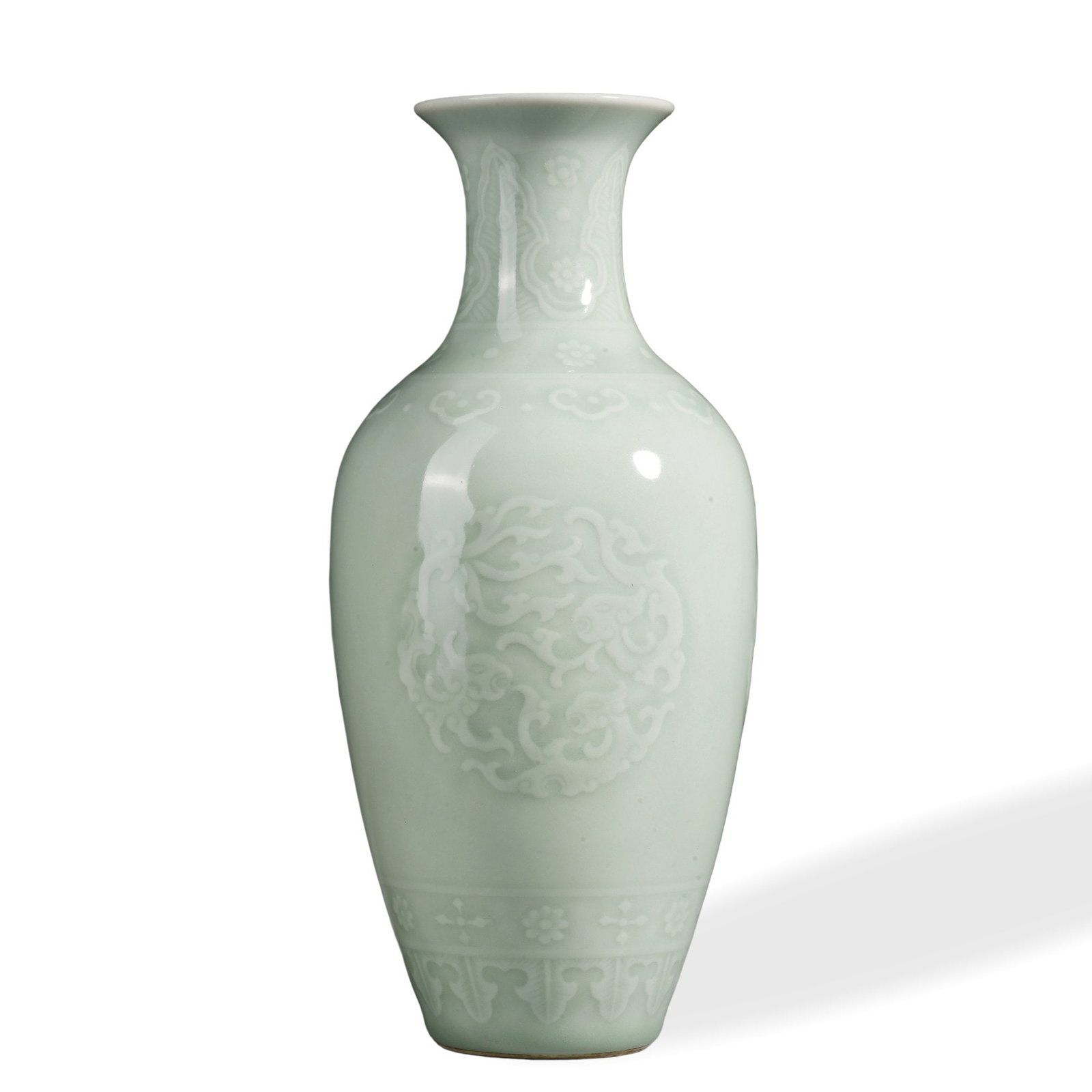 QIANLONG CELADON VASE WITH ANHUA 'FLORAL MEDALLION' DESIGN: 9 x 4 1/8 in (23 x 10.5 cm) Qianlong Celadon Vase with Anhua 'Floral Medallion' Design Dimensions: H: 9 in (23 cm); W: 4 1/8 in (10.5 cm) This refined vase exemplifies the supreme refinement of