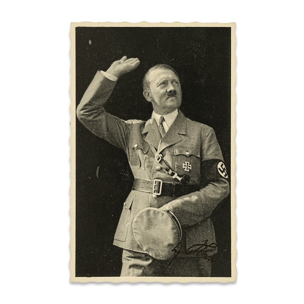 ADOLF HITLER SIGNED 1938 PORTRAIT POSTCARD: 5 1/2 x 3 1/2 in (14 x 9 cm) Provenance and Authentication: According to the Letter of Authenticity (LOA) and Certificate of Authenticity (COA) provided by the consignor, this collectible was subjecte