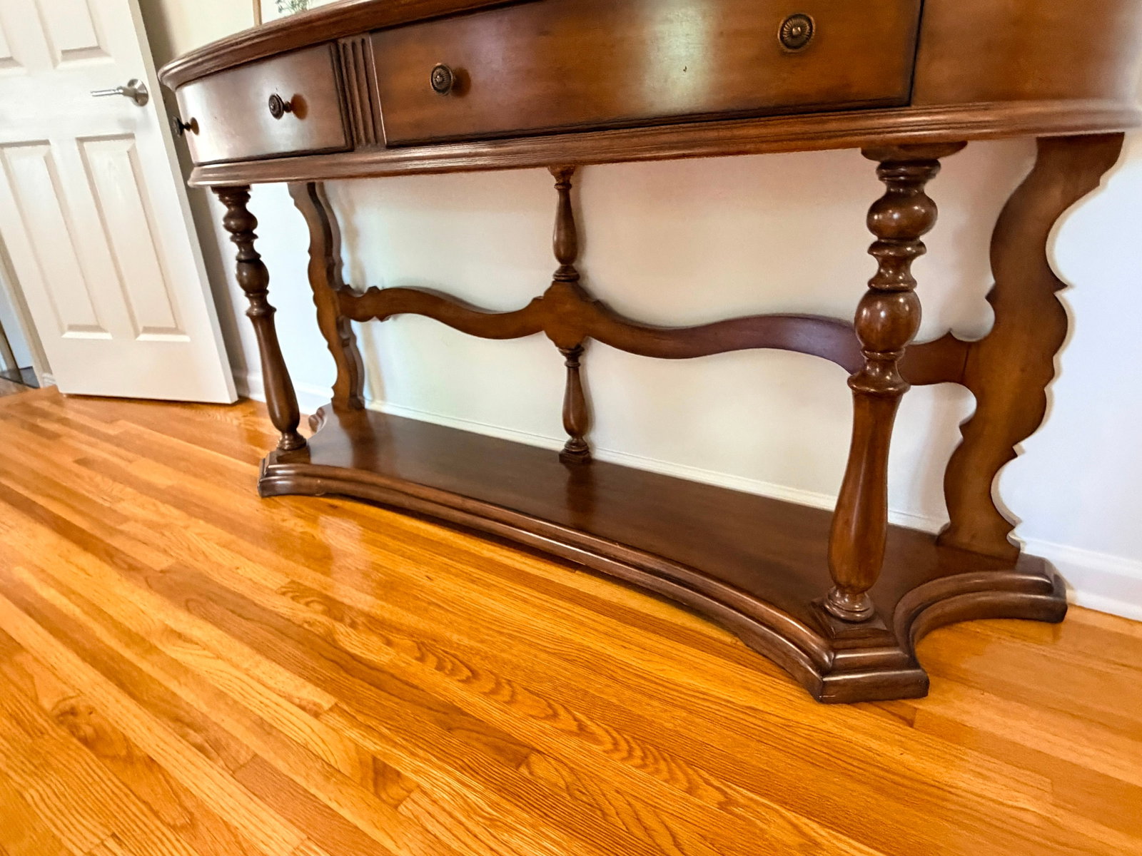 Traditional Demilune Console Table with 3 Drawers & Lower Shelf Walnut Entryway Hall Sofa Table: Traditional demilune console table with three drawers, lower shelf, and walnut finish. Elegant entryway or sofa table in classic style. This traditional demilune console table features a graceful half