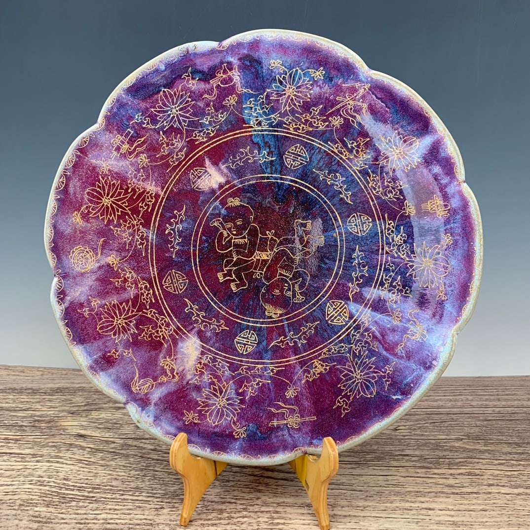 Song Dynasty Jun ware iridescent gilt plate with engraved child design: A Song Dynasty Jun ware gilt-gilt plate with engraved child design, 3.5cm high and 37cm in diameter. Thank you for viewing our auction and we look forward to serving you as a valued customer! Provenan