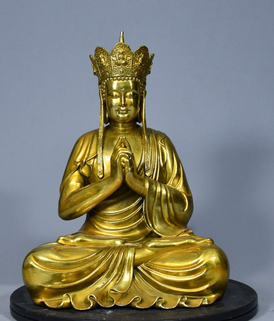 Ksitigarbha Bodhisattva, cast in fine bronze and gilded in brass: This is a gilt brass Ksitigarbha Bodhisattva statue, cast in fine bronze. The body is thick and heavy, meticulously crafted, with an elegant color and a rich, antique patina. The statue possesses a na