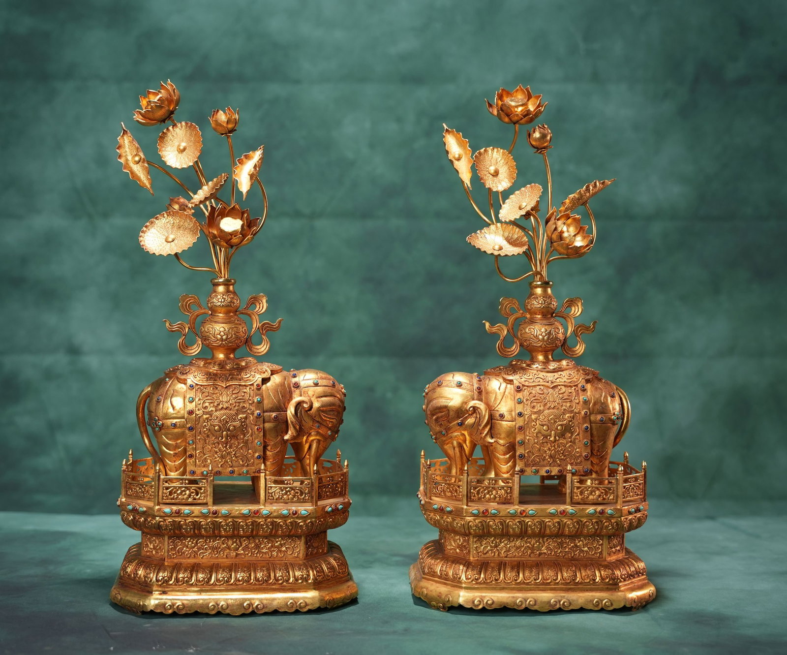 A pair of exquisitely crafted, fully gilded, temporarily engraved "Peaceful Elephant" ornaments: pair of exquisitely crafted, fully gilded elephant figurines, each 48x20cm. Thank you for viewing our auction and we look forward to serving you as a valued customer! Provenance:From an old private co