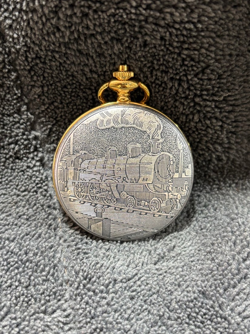 Locomotive Pocket Watch: A locomotive-shaped pocket watch with a mechanical movement, manually wound, and keeps normal time. It is approximately 50 millimeters in diameter. Thank you for viewing our auction and we look
