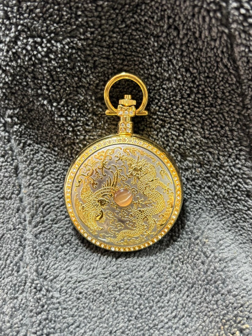 Gilded pocket watch: A gilded pocket watch with a mechanical movement, manual winding, and normal timekeeping. It has a diameter of approximately 50 mm and is a double-opening pocket watch. Thank you for viewing our