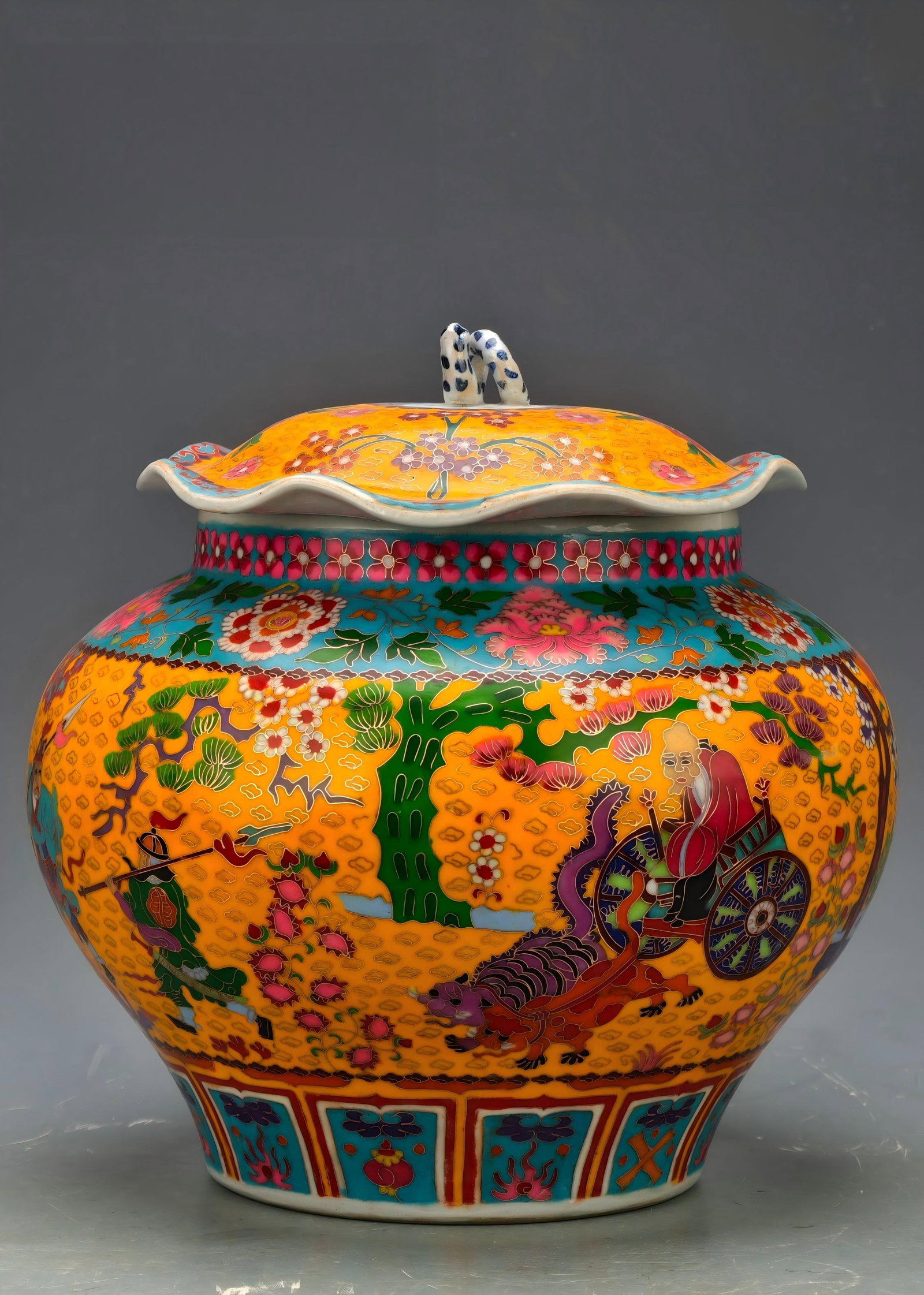 Formerly in the collection, Yuan Dynasty cloisonne enamel lotus leaf-shaped covered jar with a story: A Yuan Dynasty cloisonne enamel covered jar with a lotus leaf design depicting the story of Guiguzi descending the mountain, formerly in the collection. The entire piece is decorated with cloisonne en