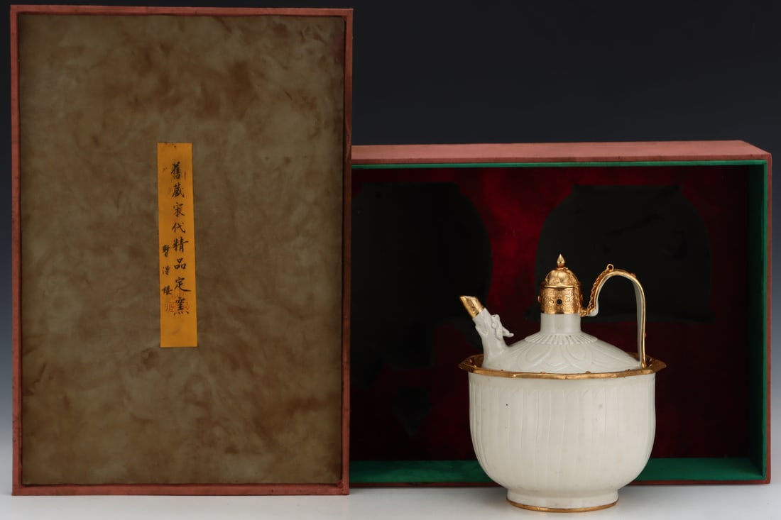 A Song Dynasty Ding ware wine warmer with gold plating and engraving, formerly in the collection.: A Song Dynasty Ding ware warming wine pot with gold plating and engraving, formerly in the collection. Dimensions: Height: 25.3cm, Diameter: 20cm. Thank you for viewing our auction and we look forward