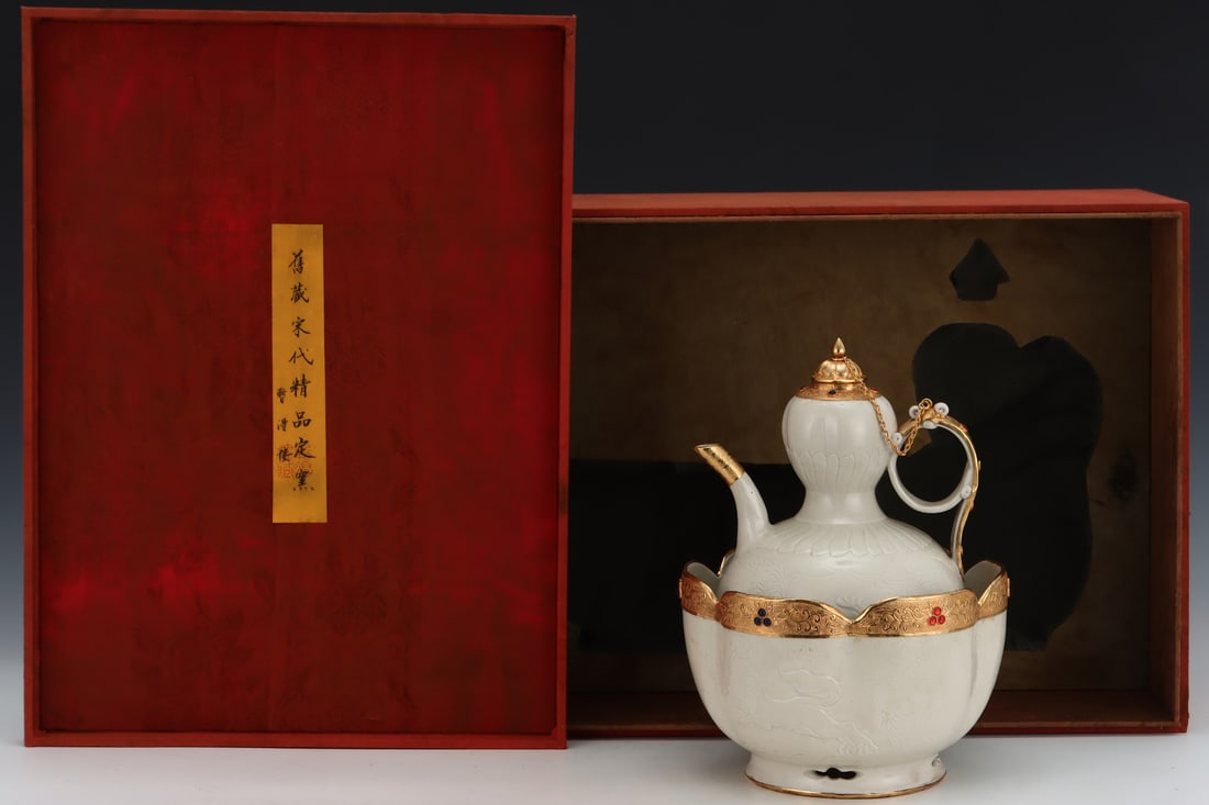 A Song Dynasty Ding ware wine warmer with gold plating and engraving, formerly in the collection.: A Song Dynasty Ding ware warming wine pot with gold plating and engraving, formerly in the collection. Dimensions: Height: 29cm, Diameter: 21.5cm. Thank you for viewing our auction and we look forward