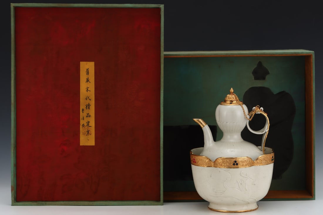 A Song Dynasty Ding ware wine warmer with gold plating and engraving, formerly in the collection.: A Song Dynasty Ding ware warming wine pot with gold plating and engraving, formerly in the collection. Dimensions: Height: 29cm, Diameter: 21.3cm. Thank you for viewing our auction and we look forward