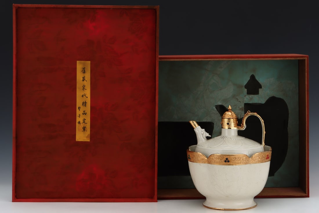 A Song Dynasty Ding ware wine warmer with gold plating and engraving, formerly in the collection.: A Song Dynasty Ding ware warming wine pot with gold plating and engraving, formerly in the collection. Dimensions: Height: 25.5cm, Diameter: 22cm. Thank you for viewing our auction and we look forward