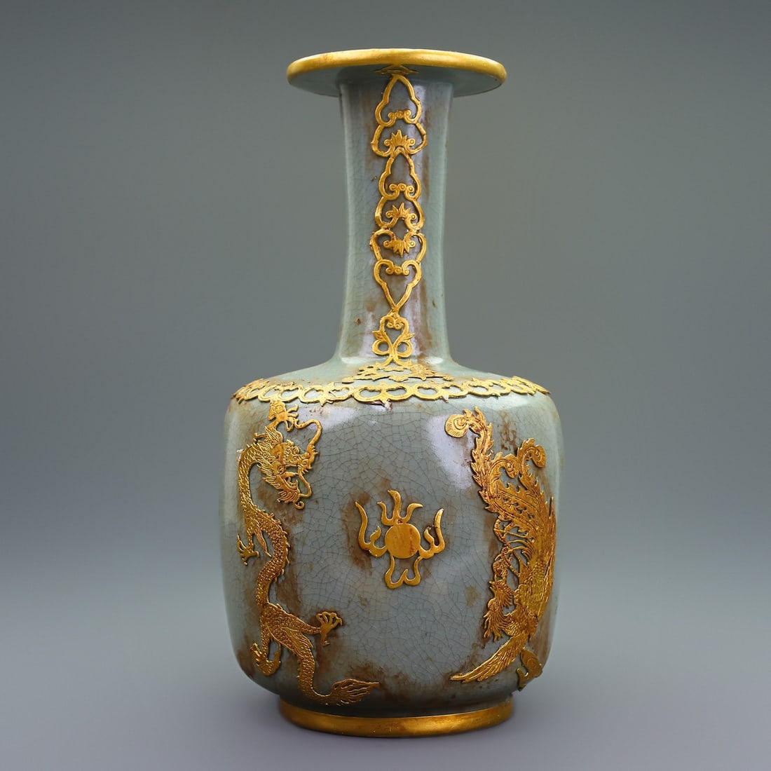 Treasured Collection of Gold-Plated Ru Ware Dragon and Phoenix Vase: This is a rare, gilded Ru ware porcelain vase with dragon and phoenix design, exquisitely crafted and uniquely made. It exudes elegance and sophistication. Weight: 1650g, Height: 32cm, Width: 16cm.