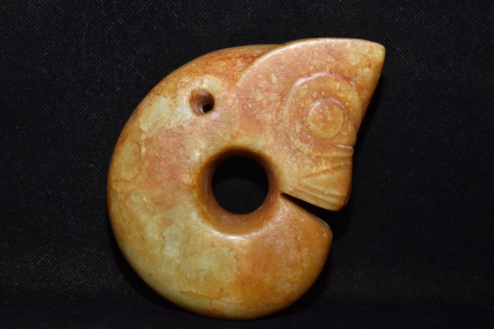 Hongshan Culture Hemo Jade Pig Dragon: A finely polished jade pig-dragon from the Hongshan Culture, with a delicate patina, worthy of collection. Dimensions: 9cm wide, 13cm high, weight: 620g. Provenance:Private Estate, Michigan. Our coope