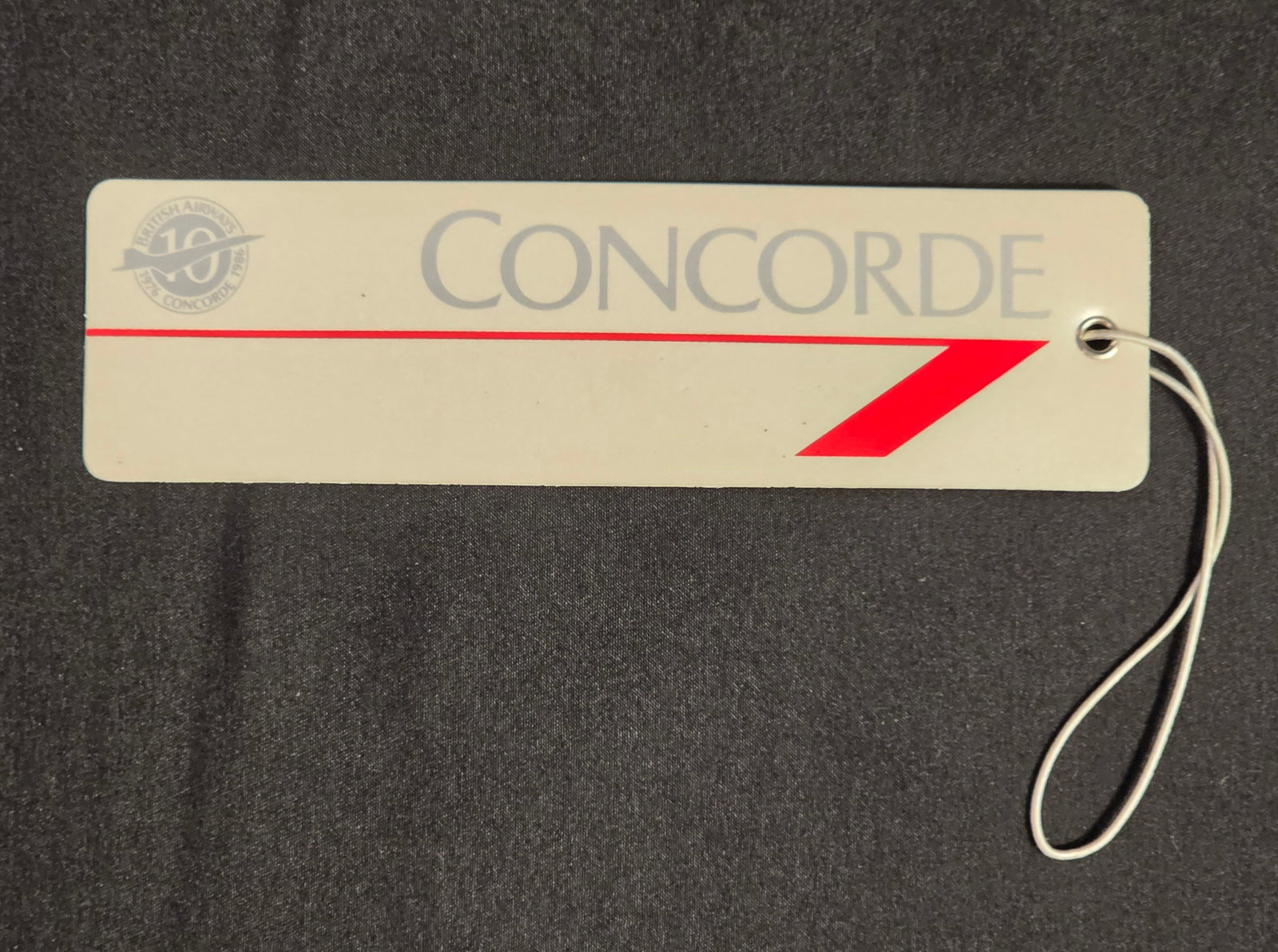 British Airways Concorde Luggage Tag: Vintage British Airways Concorde 10 Year Anniversary Luggage Tag from the 1986. 50% of all proceeds from the sale of this lot will be donated to the Raise Your Banner Foundation, a Washington DC based