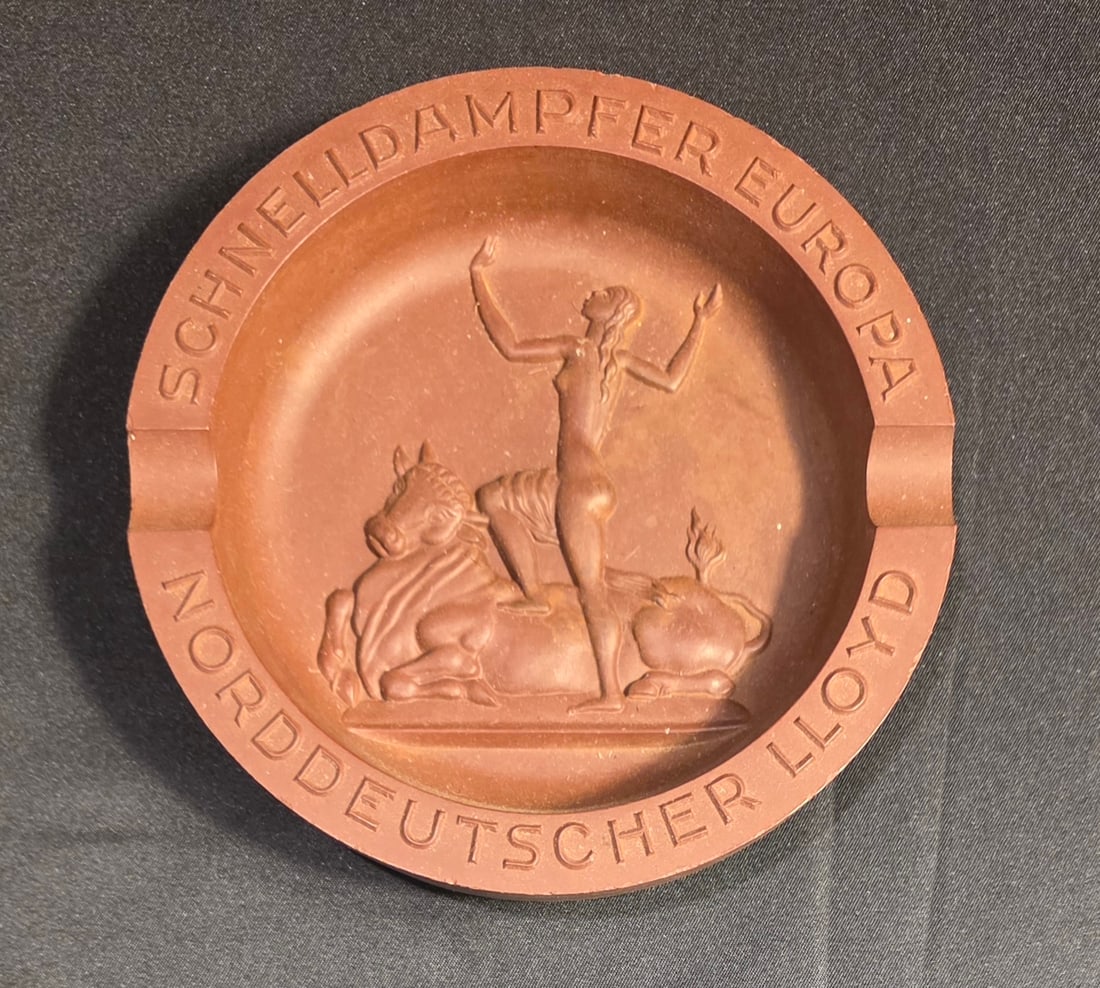 Lloyd Bremen S.S. Europa Ashtray: 5 1/2" Bakelite. 50% of all proceeds from the sale of this lot will be donated to the Raise Your Banner Foundation, a Washington DC based non-profit whose mission is to break down the stigma