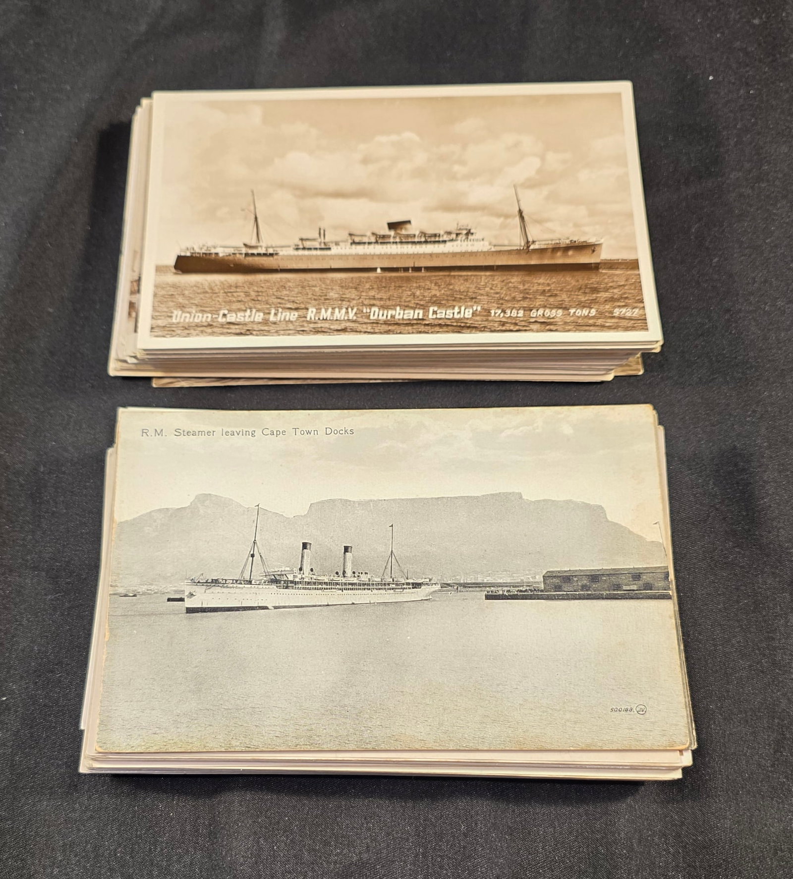 Union Castle Line Post Cards: 86 total. Mix of Union Castle Line ship postcards and RPCs. 50% of all proceeds from the sale of this lot will be donated to the Raise Your Banner Foundation, a Washington DC based non-profit whose