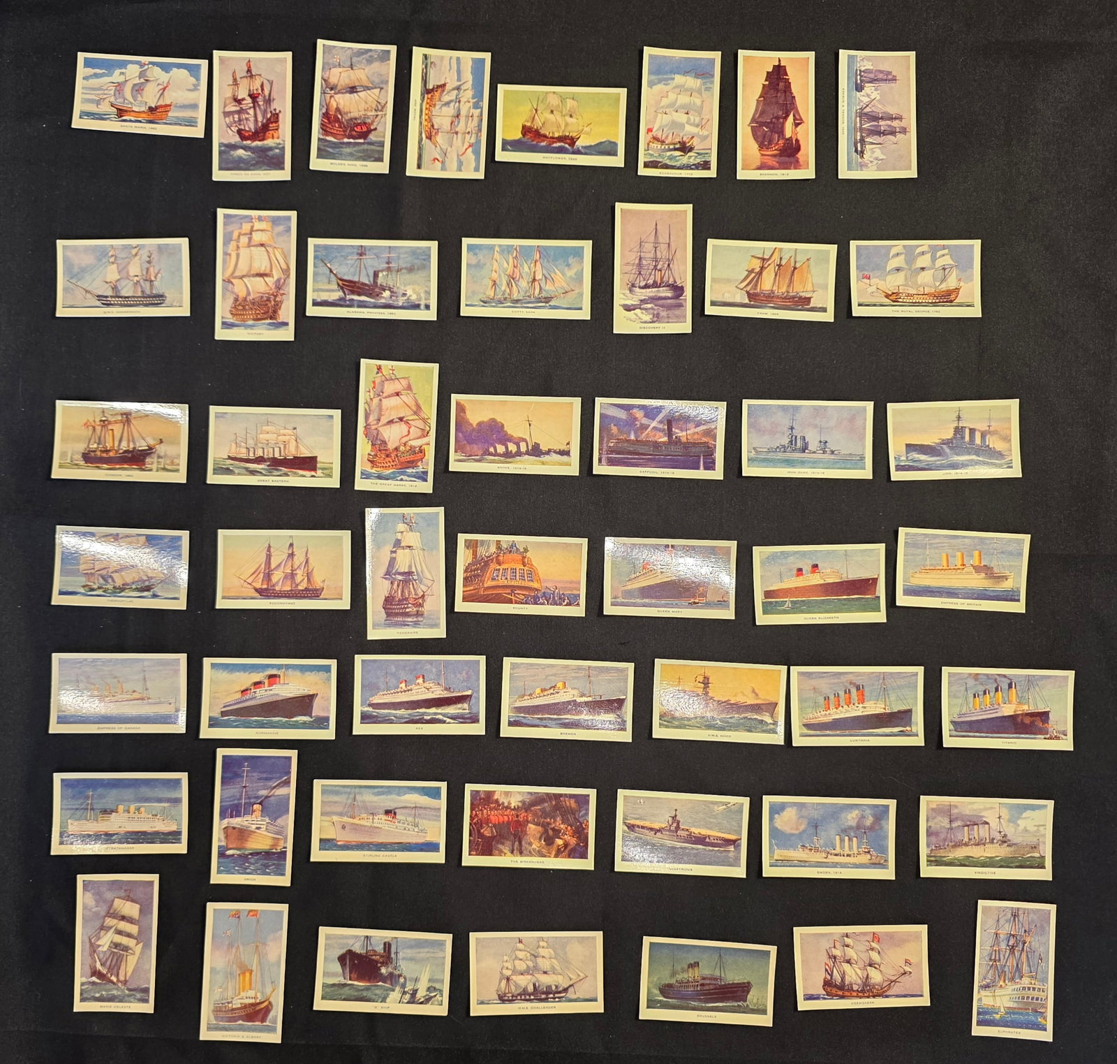 Famous Ships Cigarette Cards: 47 total. R&J Hill tobacco cards. Titanic, Lusitania, Normandie, Queen Mary, and more. Date: 1940s. 50% of all proceeds from the sale of this lot will be donated to the Raise Your Banner Foundation,